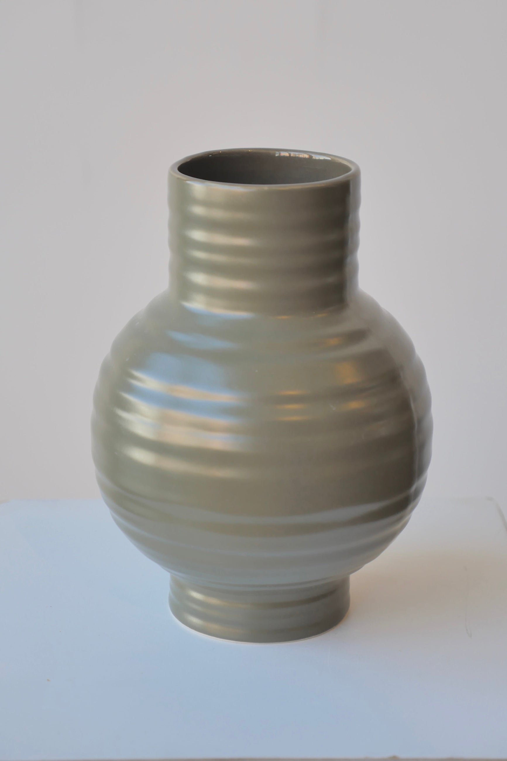 Essential Olive Ceramic Vase in large showing the horizontal ribbing. ©Sprout Home