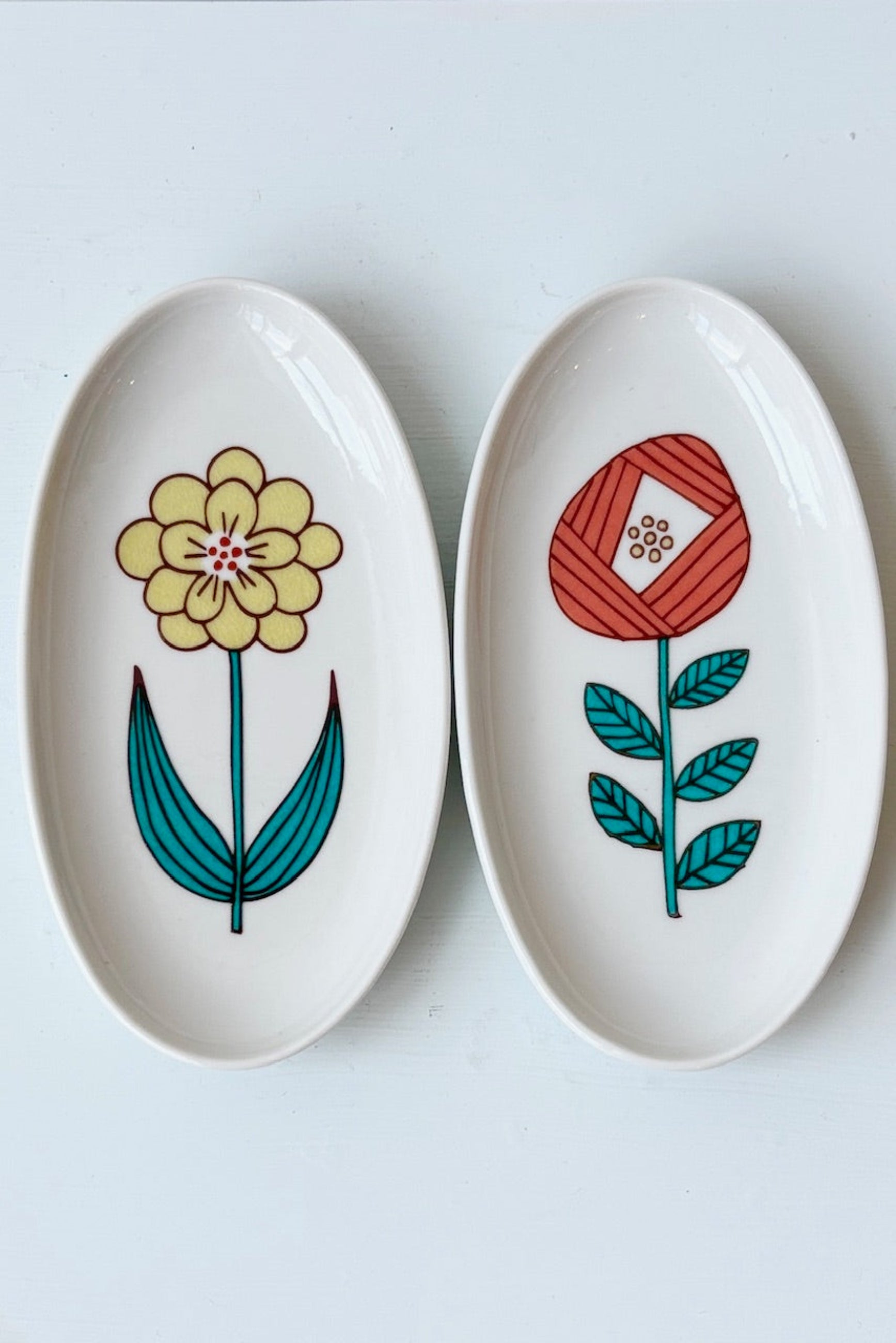 Harekutani flower dishes in yellow and red displayed on a white background ©Sprout Home