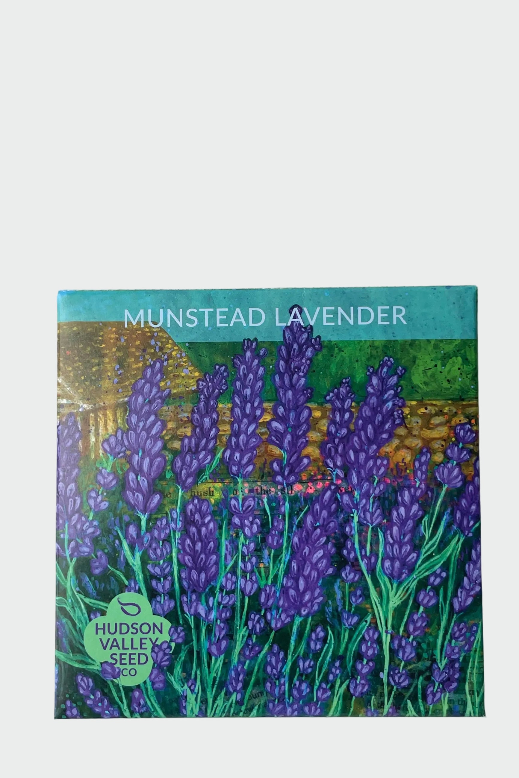 A packet of Munstead Lavender seeds by Hudson Valley Seed Co. shown from the front with the beautiful art pack drawing ©Sprout Home