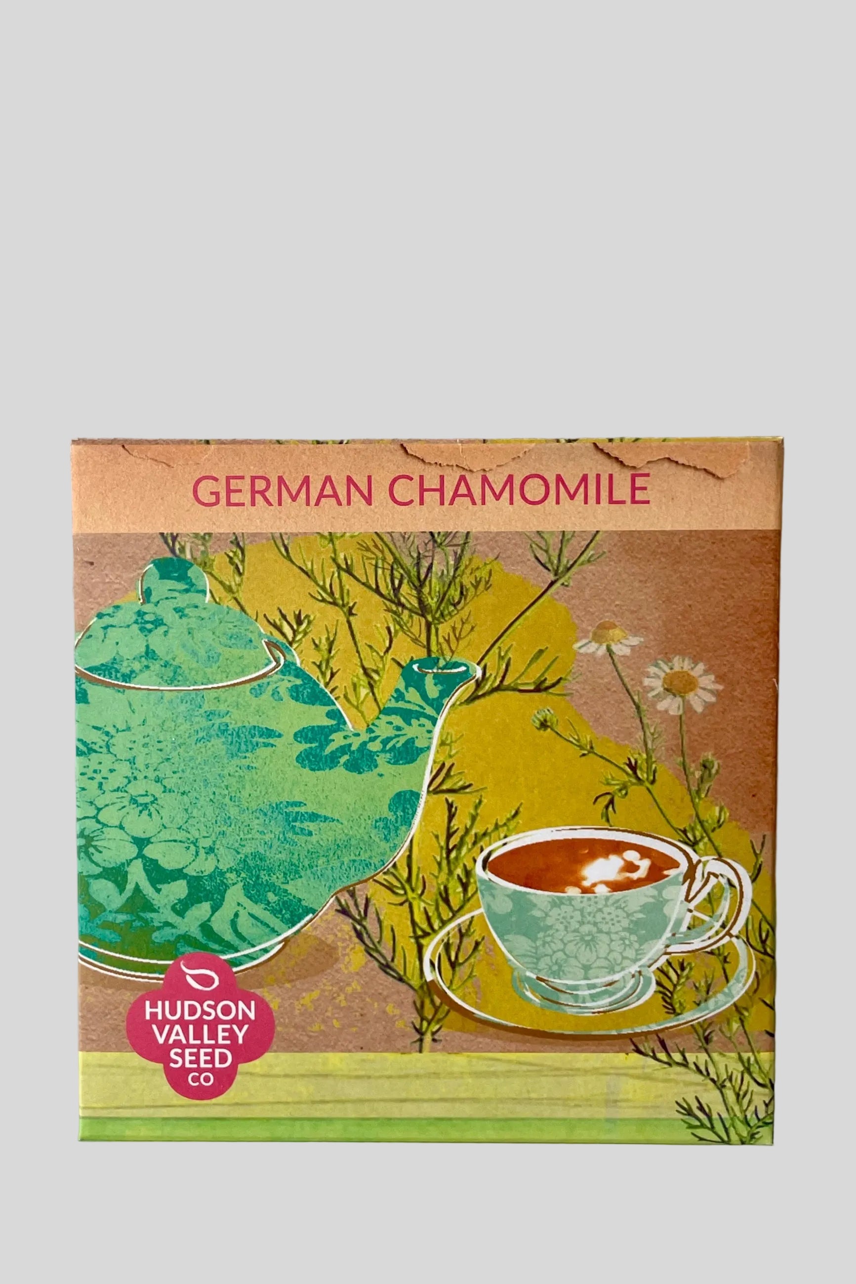 Packaging for German Chamomile seeds featuring an illustration of a chamomile flower, a cup of tea, and the text 'GERMAN CHAMOMILE' on a colorful background. ©Sprout Home