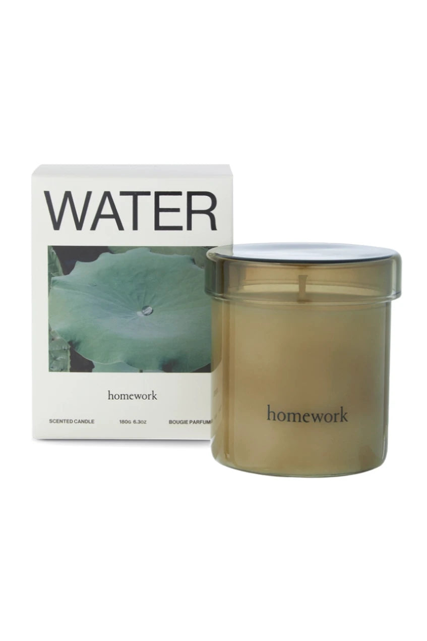 Water candle showing the packaging and also the glass filled candle by Homework.
