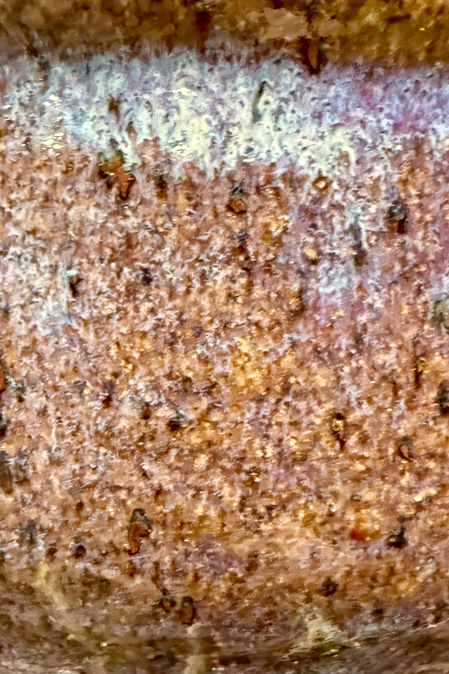 Close-up of a deep muddled brown yellow with brown spots Glazed ceramic from Bruning Pottery ©Sprout Home