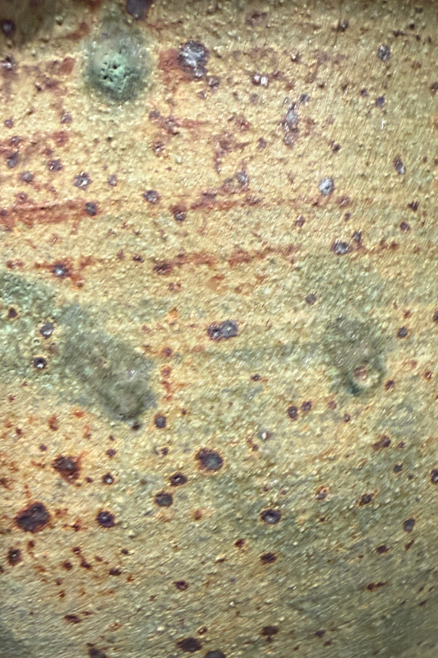 Close-up of a Matt khaki olive green with brown spots Glazed ceramic from Bruning Pottery ©Sprout Home