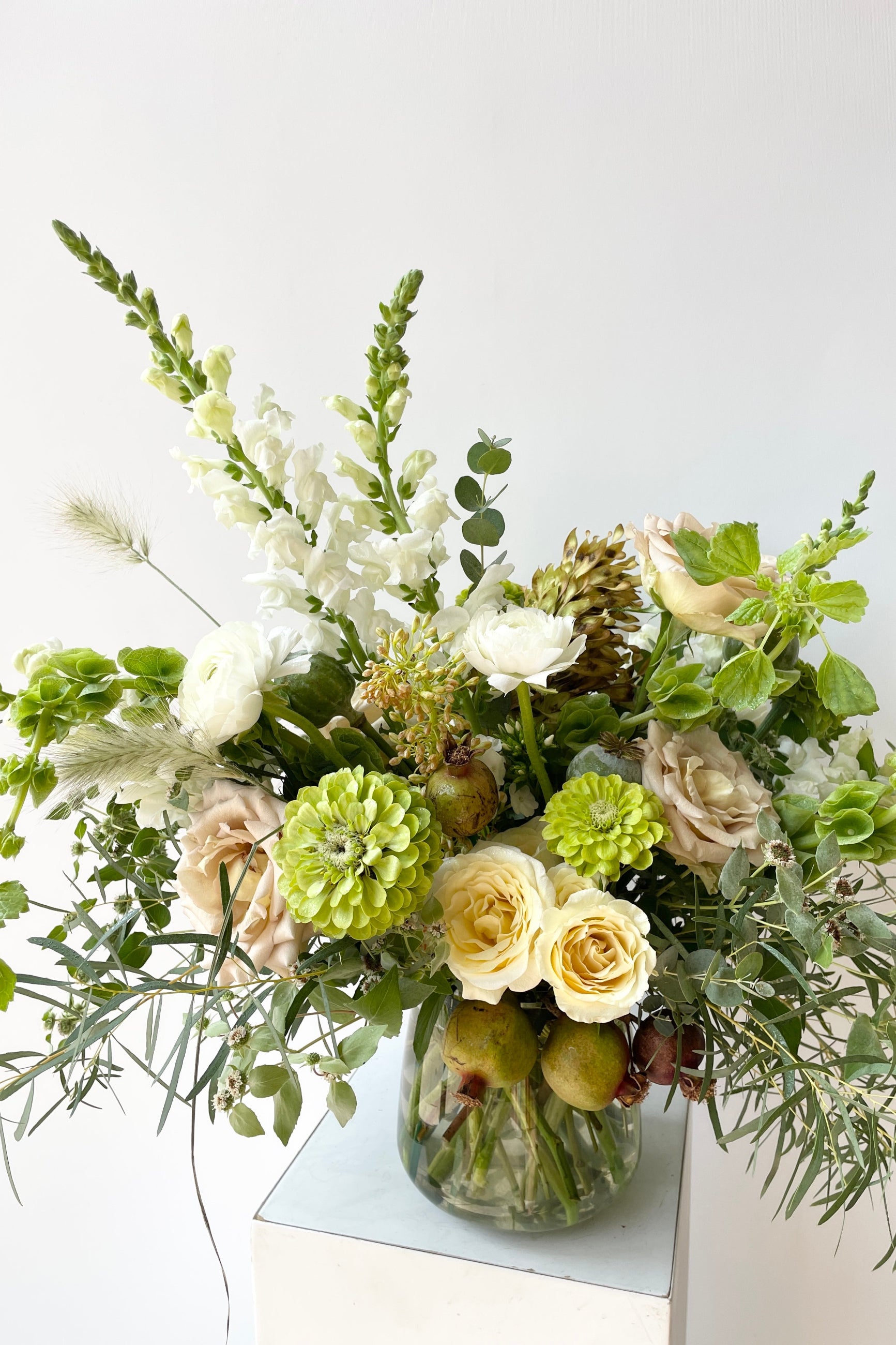 A Custom Bleached arrangement by Sprout Home in August featuring zinnia and snapdragons ©Sprout Home #size_$200