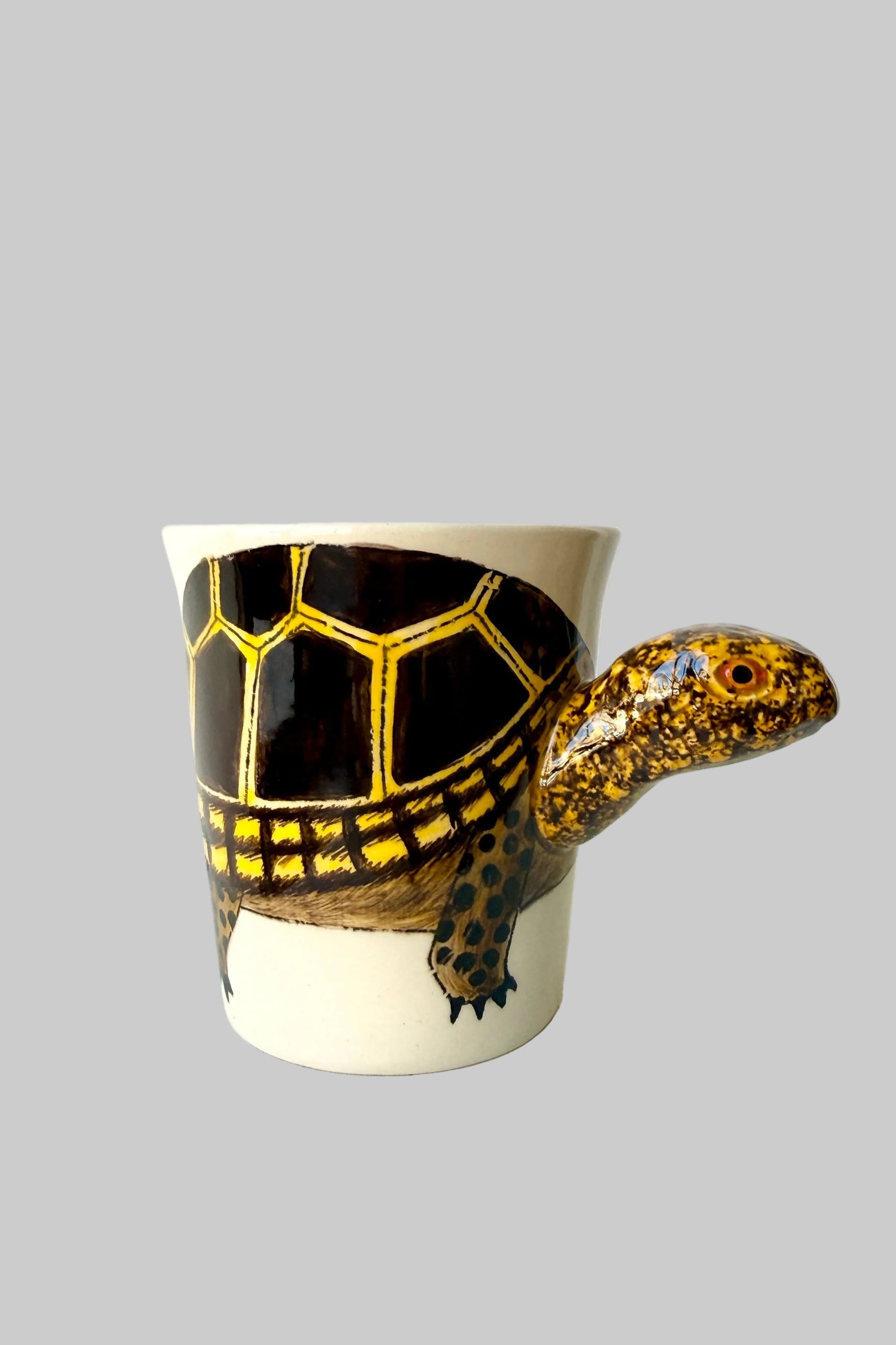 Ceramic mug shaped like a tortoise with a white background ©Sprout Home