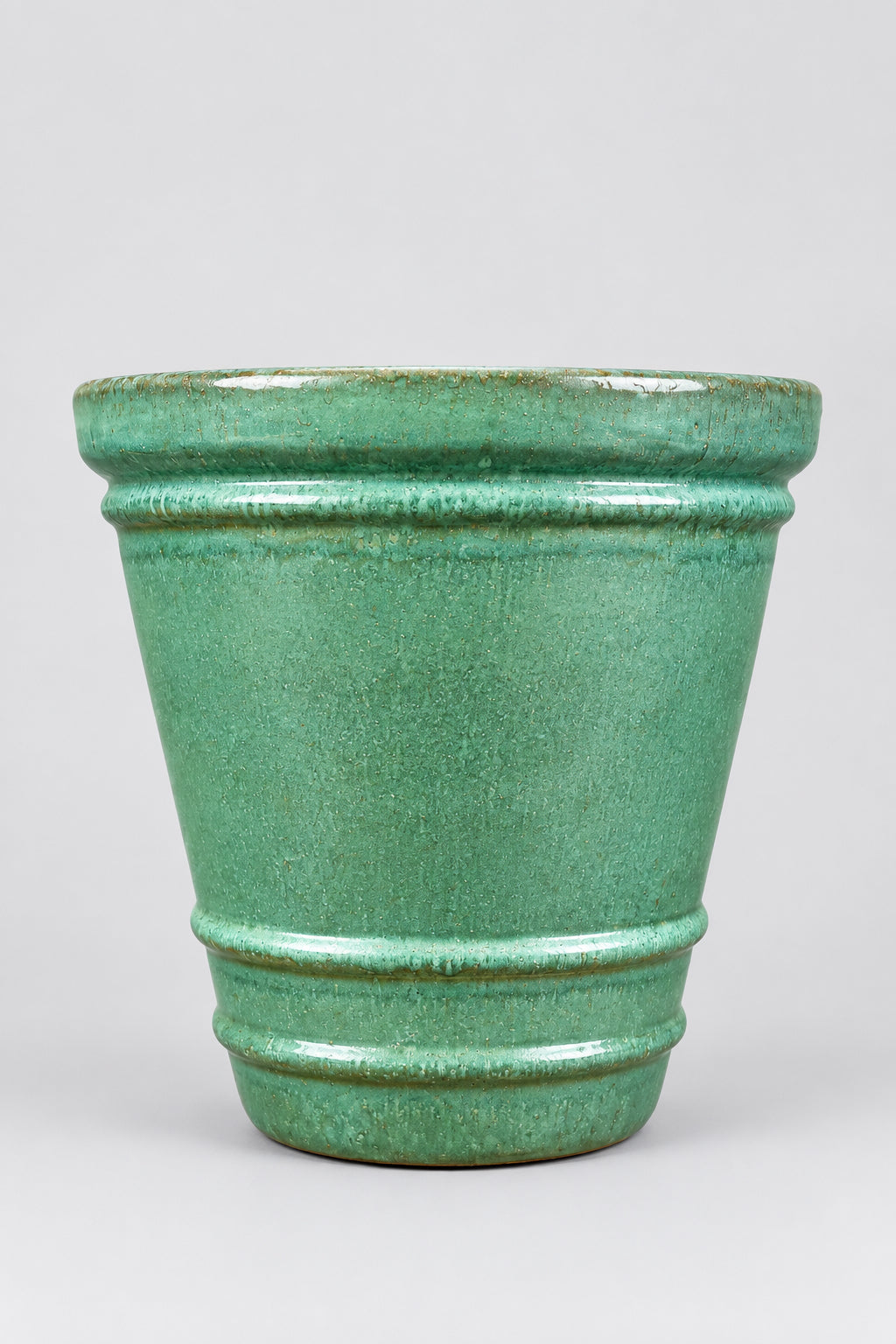 Lainey Sage Planter Medium in front of a gray background ©Sprout Home