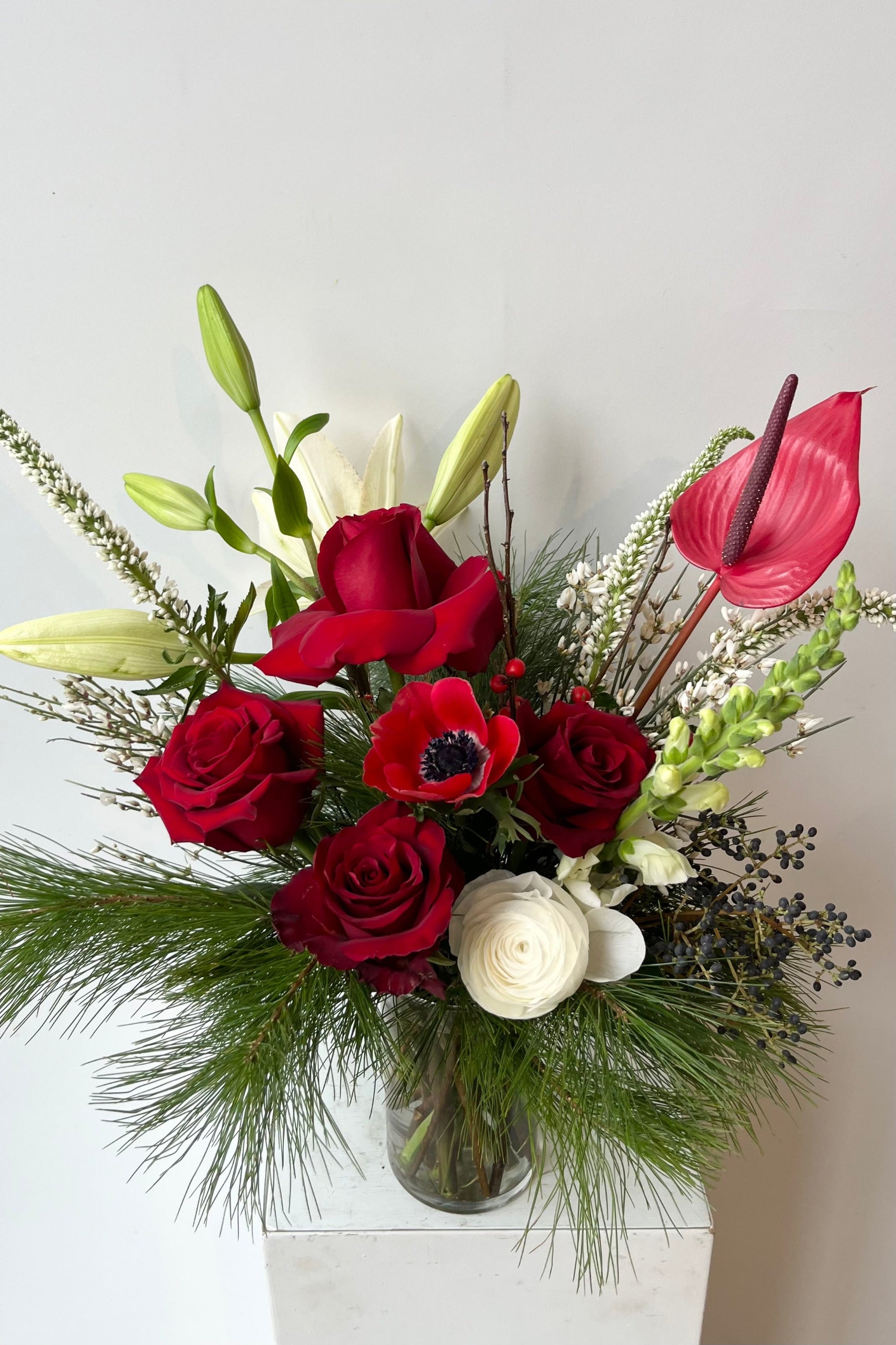 A hand holds an example of fresh Floral Arrangement Solstice at $90 from Sprout Home Floral in Chicago ©Sprout Home #size_$100