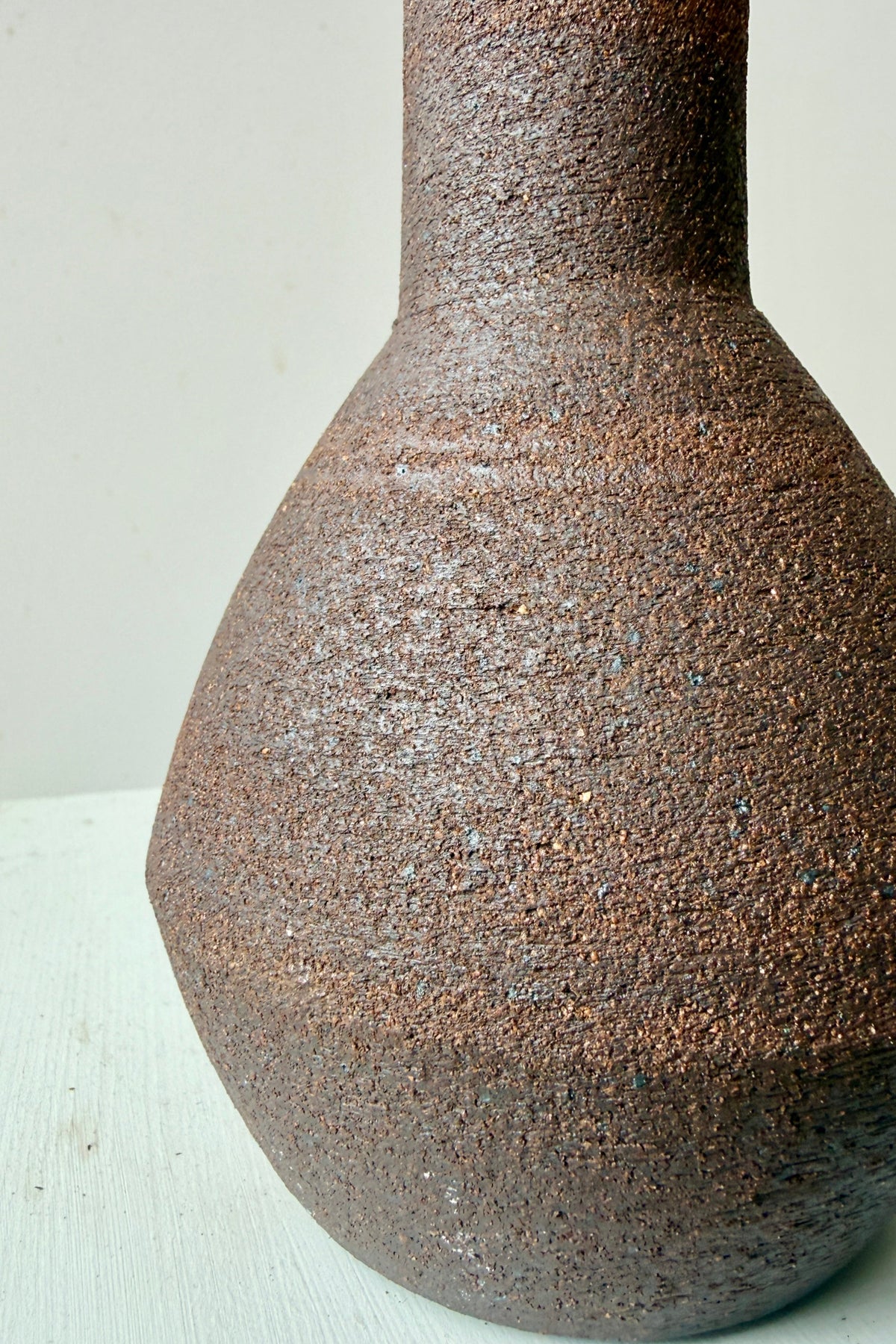 an up close picture of Long Neck Ceramic Vase No. 2 Dark Brown Large showing the finish ©Sprout Home