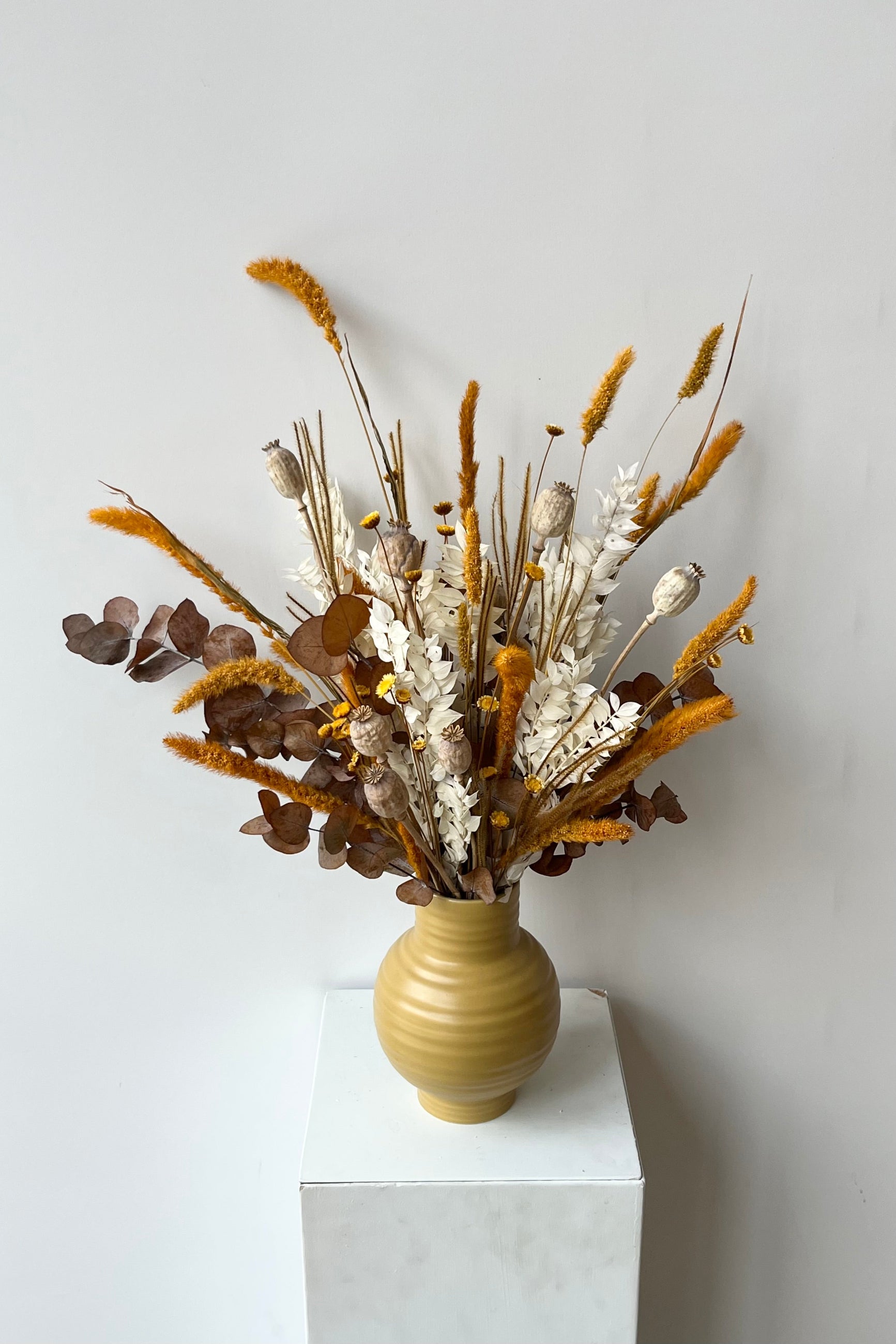 Sprout Home's Golden Hour preserved arrangement with dried floral in the colors yellow, white and tans in front of white background. ©Sprout Home #size_$125