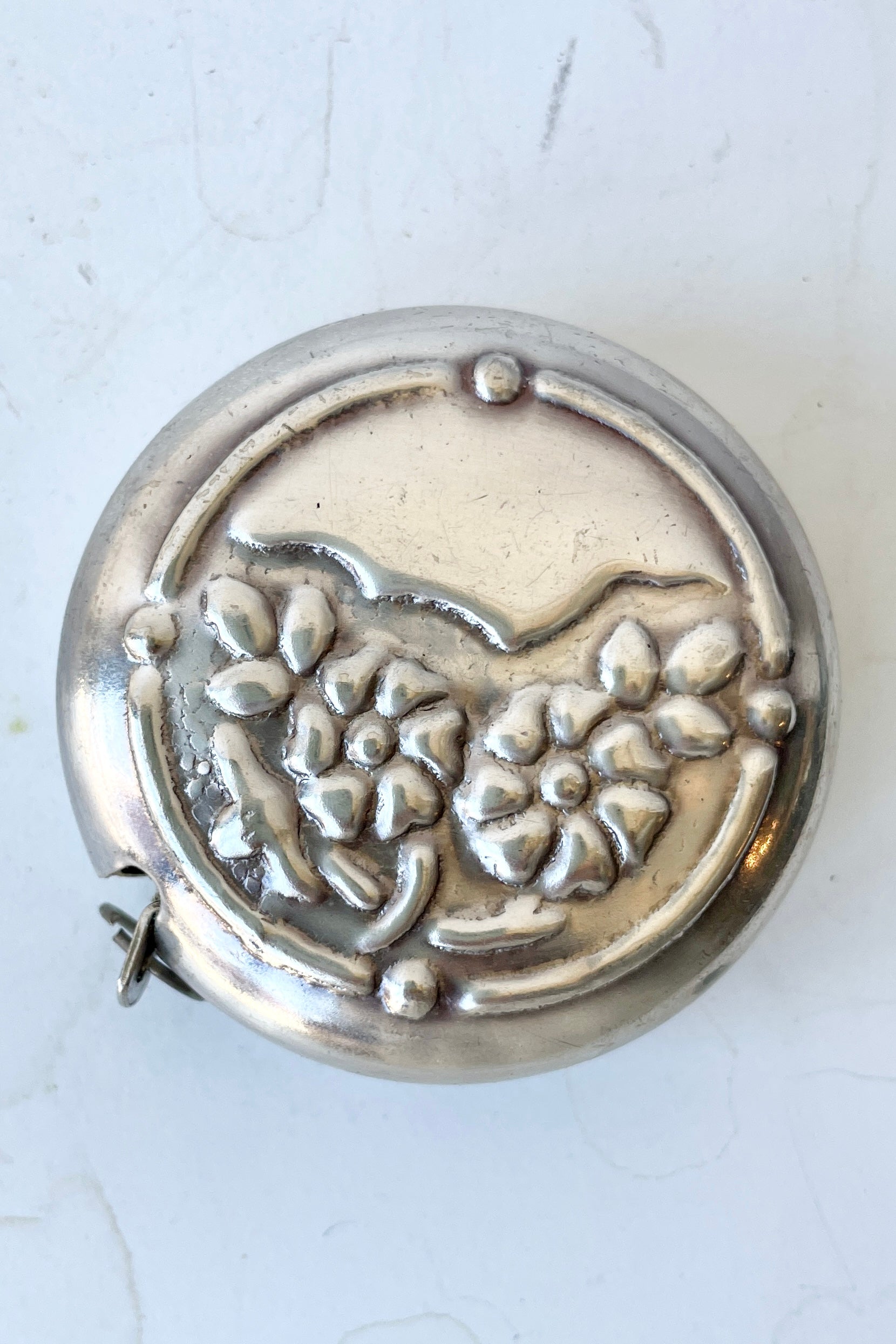 The flowers measuring tape shown from one of the flat sides on a white background at Sprout Home. ©Sprout Home