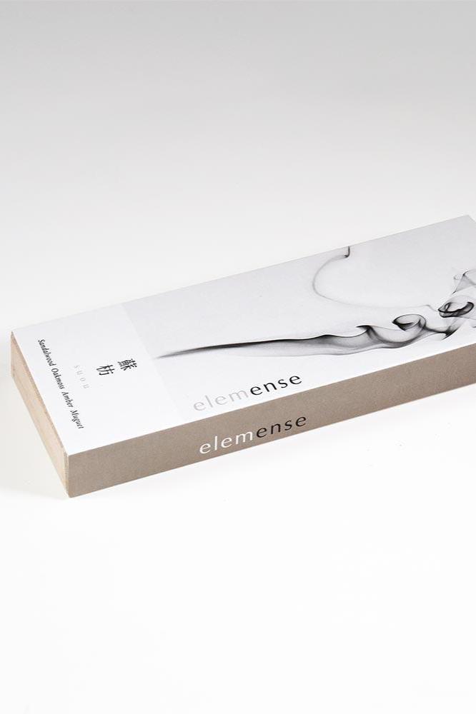 Elemense Suou Incense shown with it laying flat in its box.