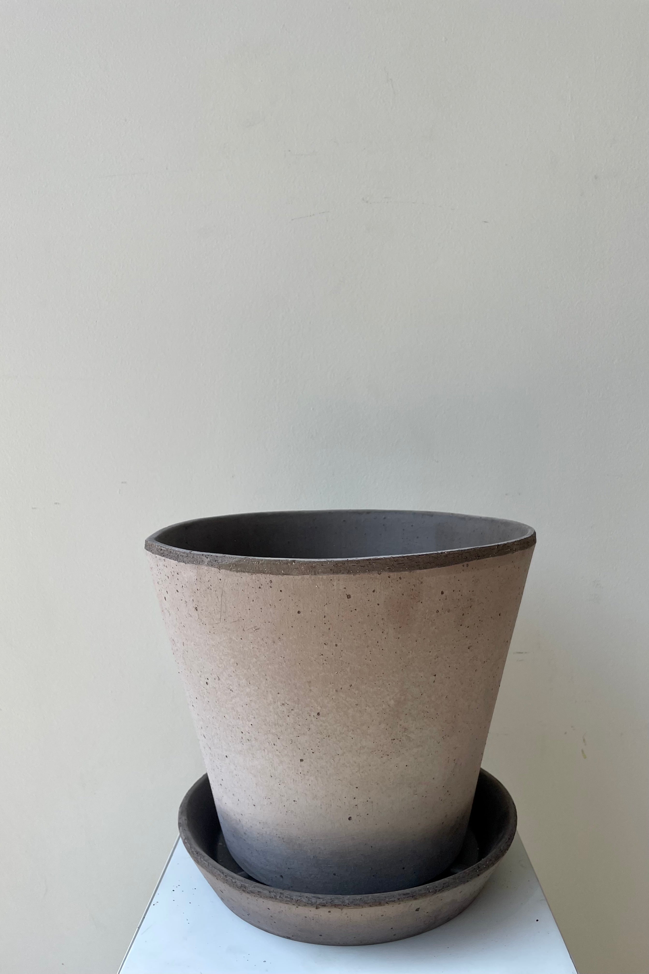 Julie Pot & Saucer grey 9.8” against a white wall