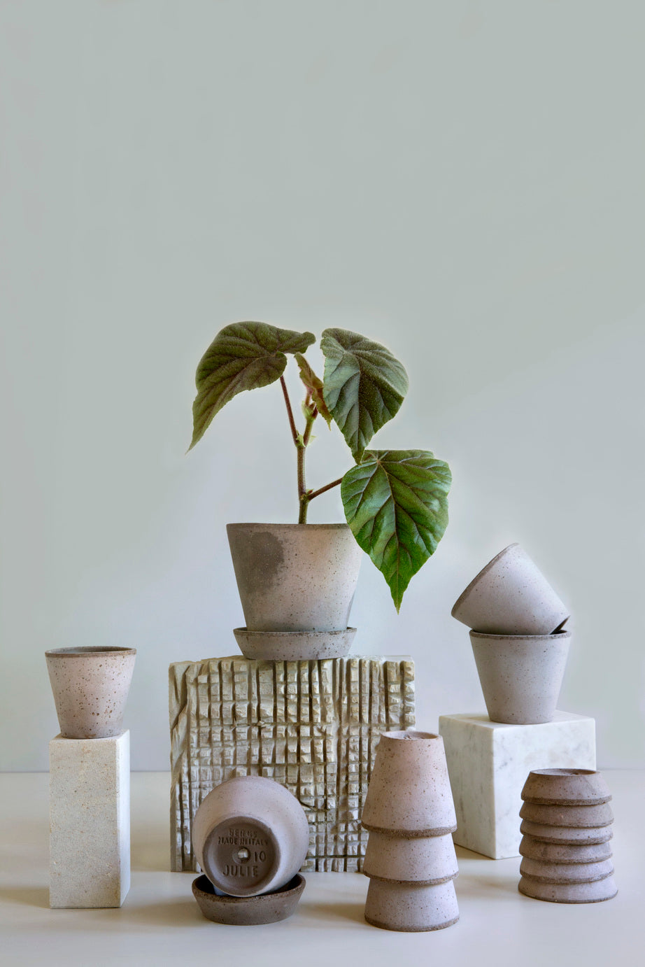 A series of various sized stacked Grey Julie Pots and saucers by Bergs Potter ©Bergs Potter