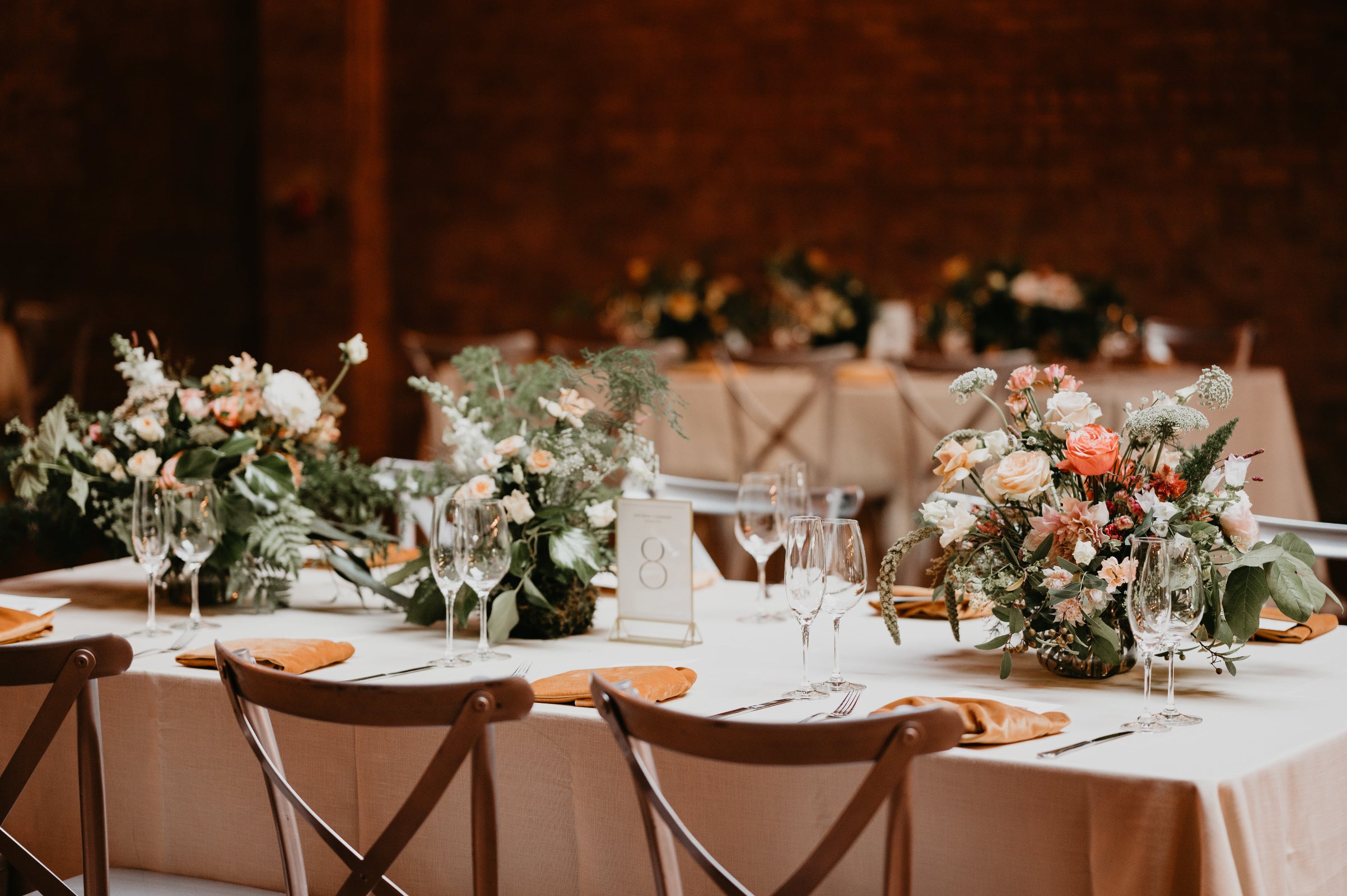 A series of light pastels and white neutral table arrangements for Kathryn & Conner's wedding at Rockwell on the River. Photographed by Lauren Dixon Photo