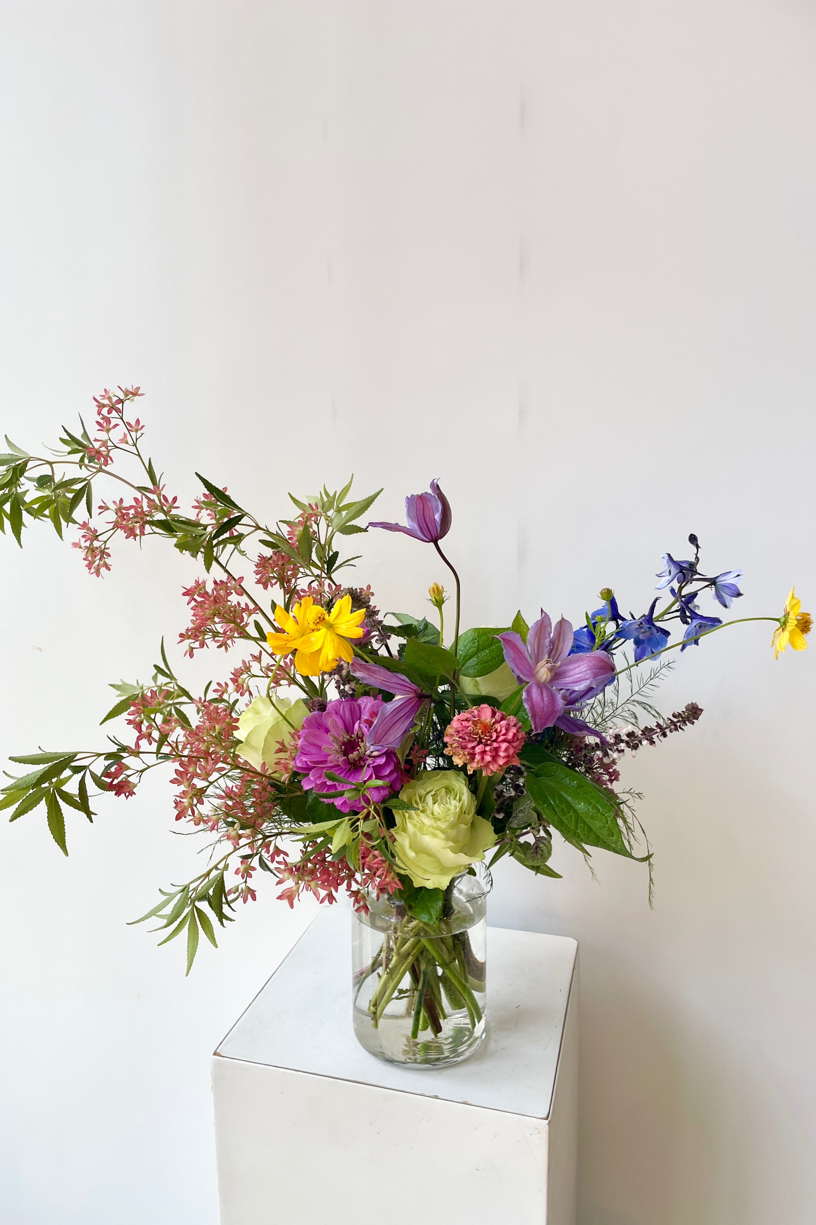 Custom Mid Day arrangement by Sprout Home mid may featuring purple, pink and cream in a Libbey jar. #size_$65
