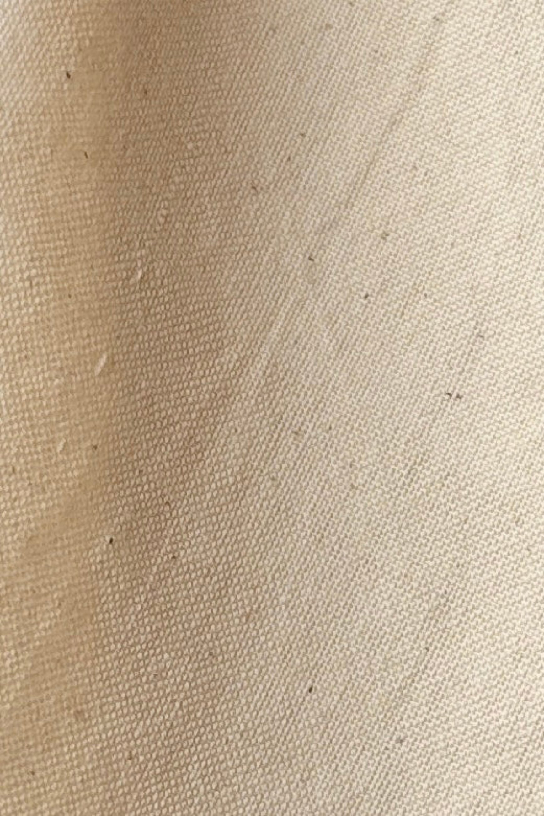 Close up of 100% cotton, homespun, handwoven napkin in color sand against a white backgound ©Sprout Home