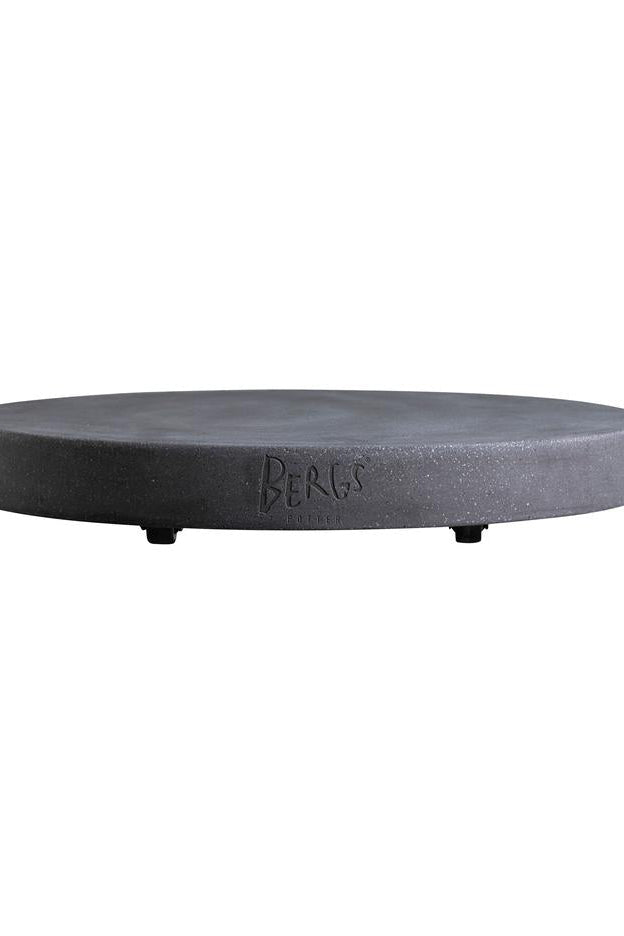Round black stone coaster with 'BERGS' branding on a white background ©Bergs Potter