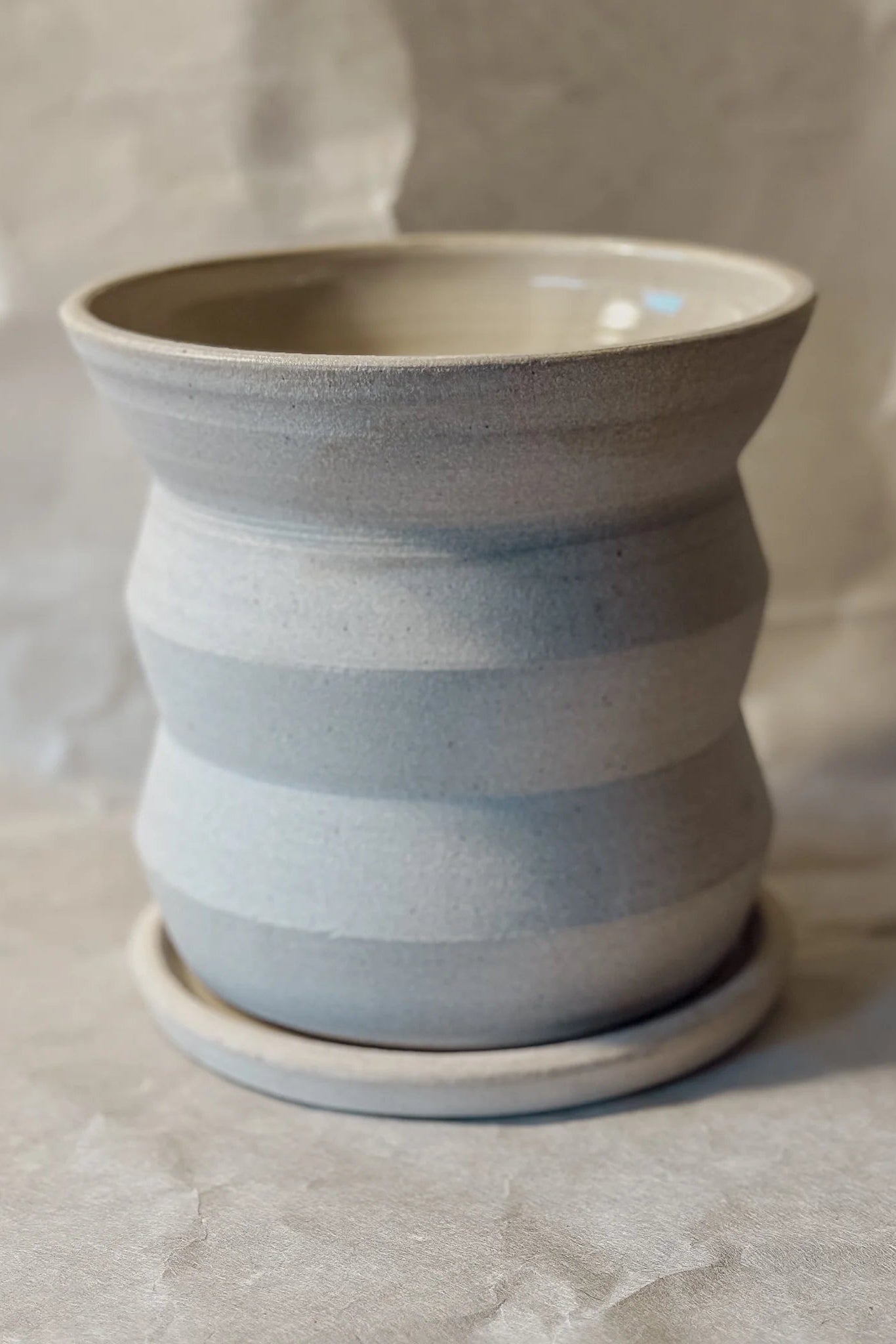 Creme Angled Planter by Olivia Snow Ceramics, empty and viewed from the side. ©Olivia Snow Ceramics