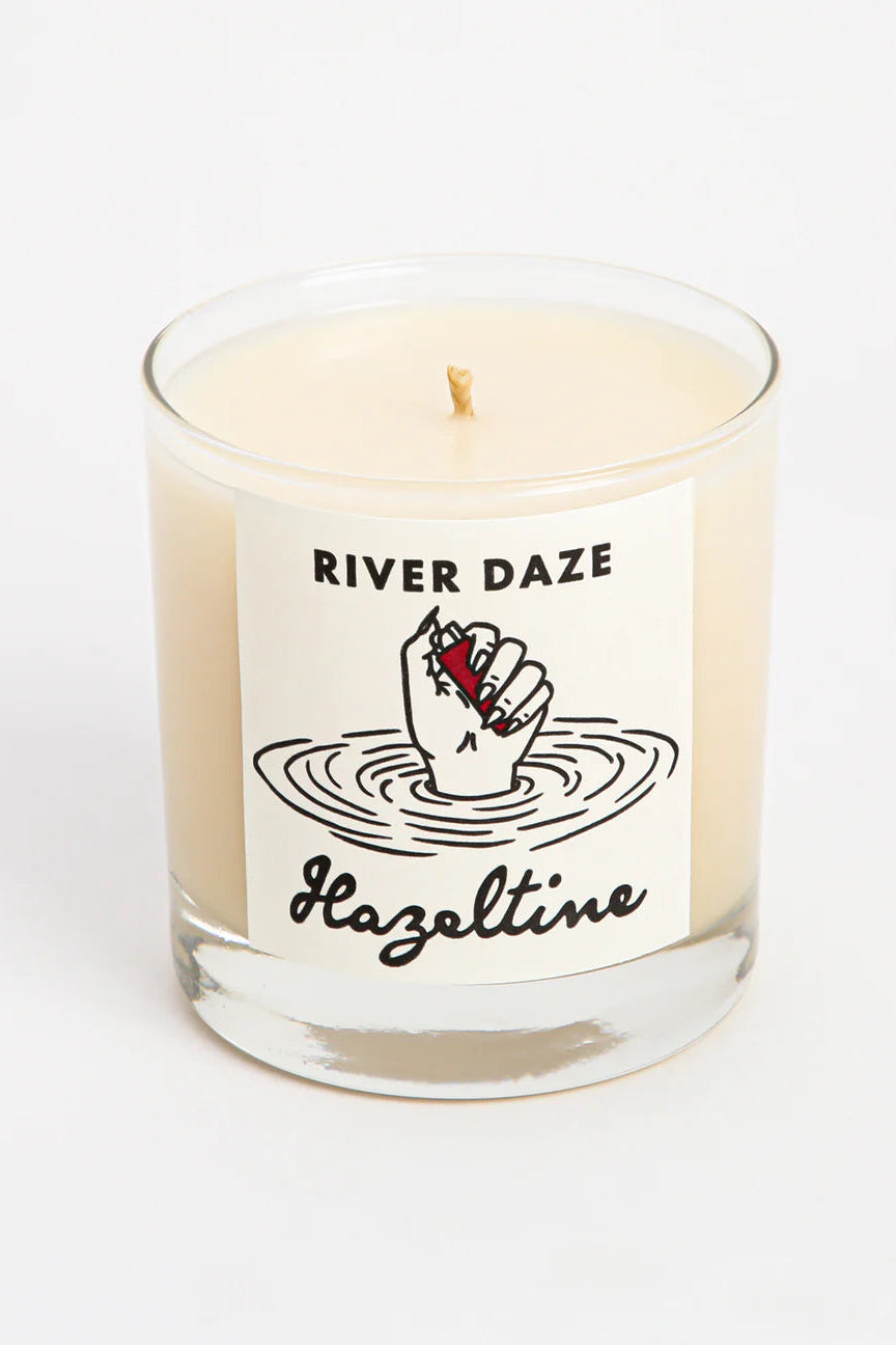 Candle with 'River Daze Hazeltine' label on a white background ©Hazeltine
