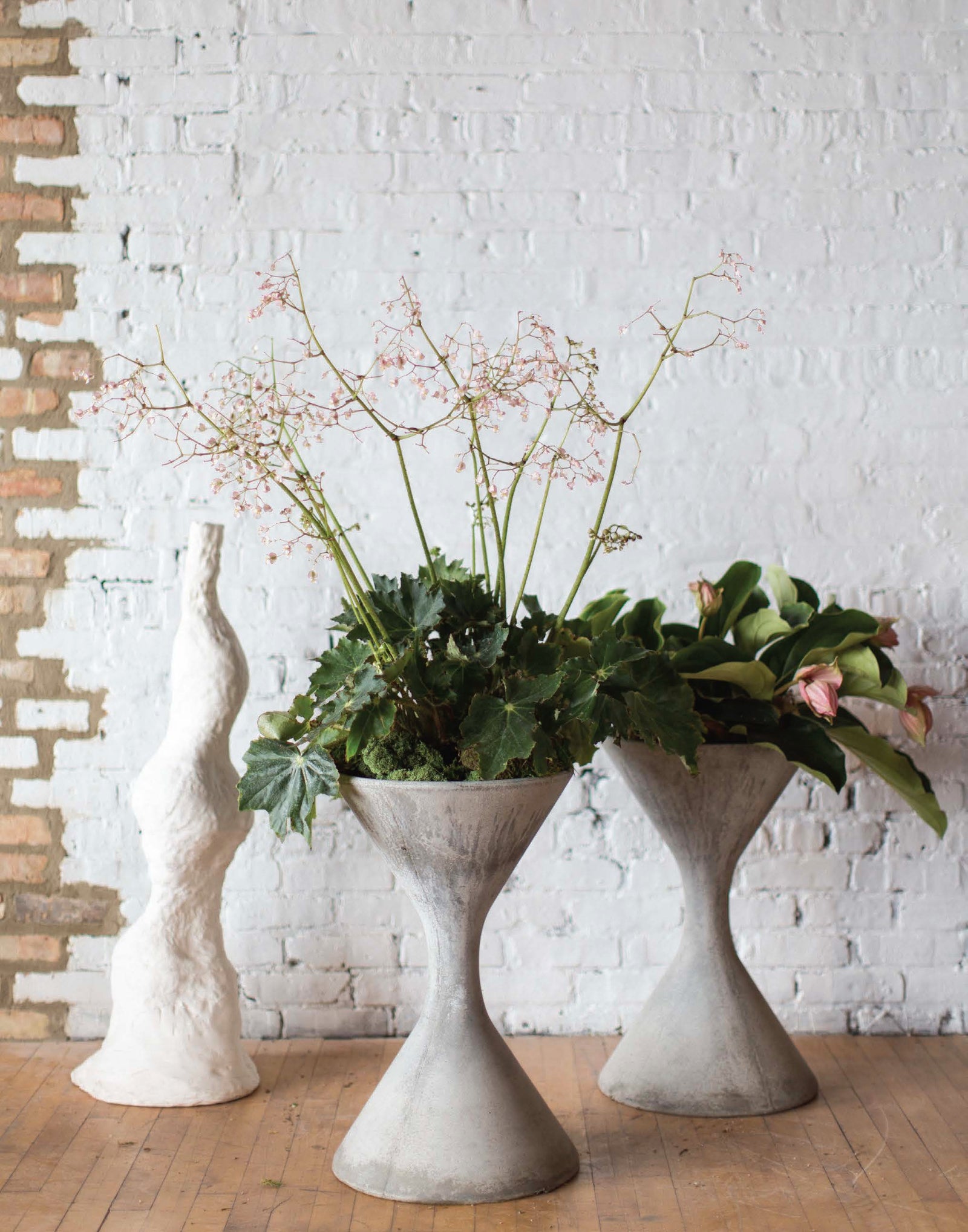 set of hourglass planters in an industrial complex by Sprout Home