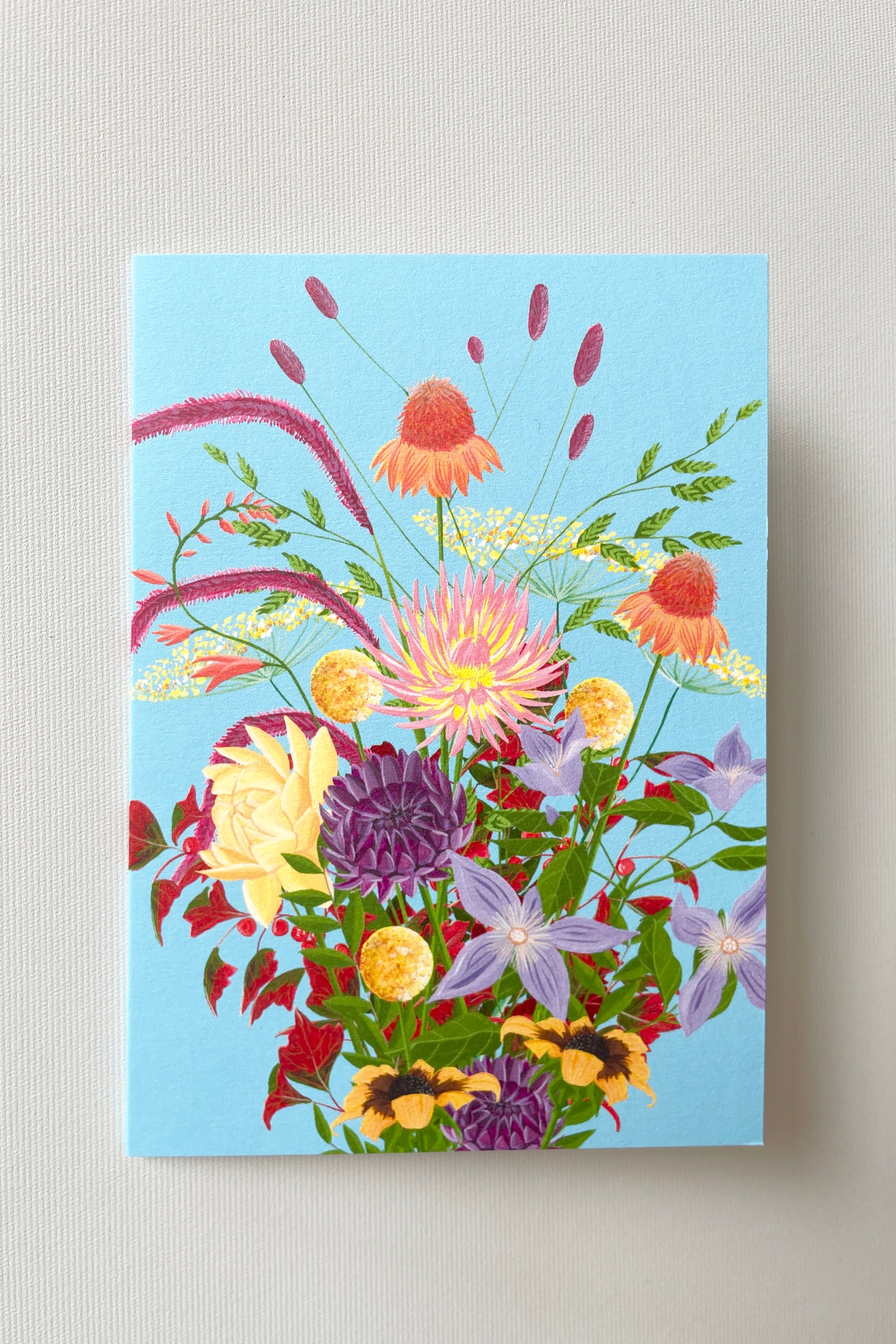 The Rebel Rebel greeting card by Stengun featuring a wild floral arrangement on blue