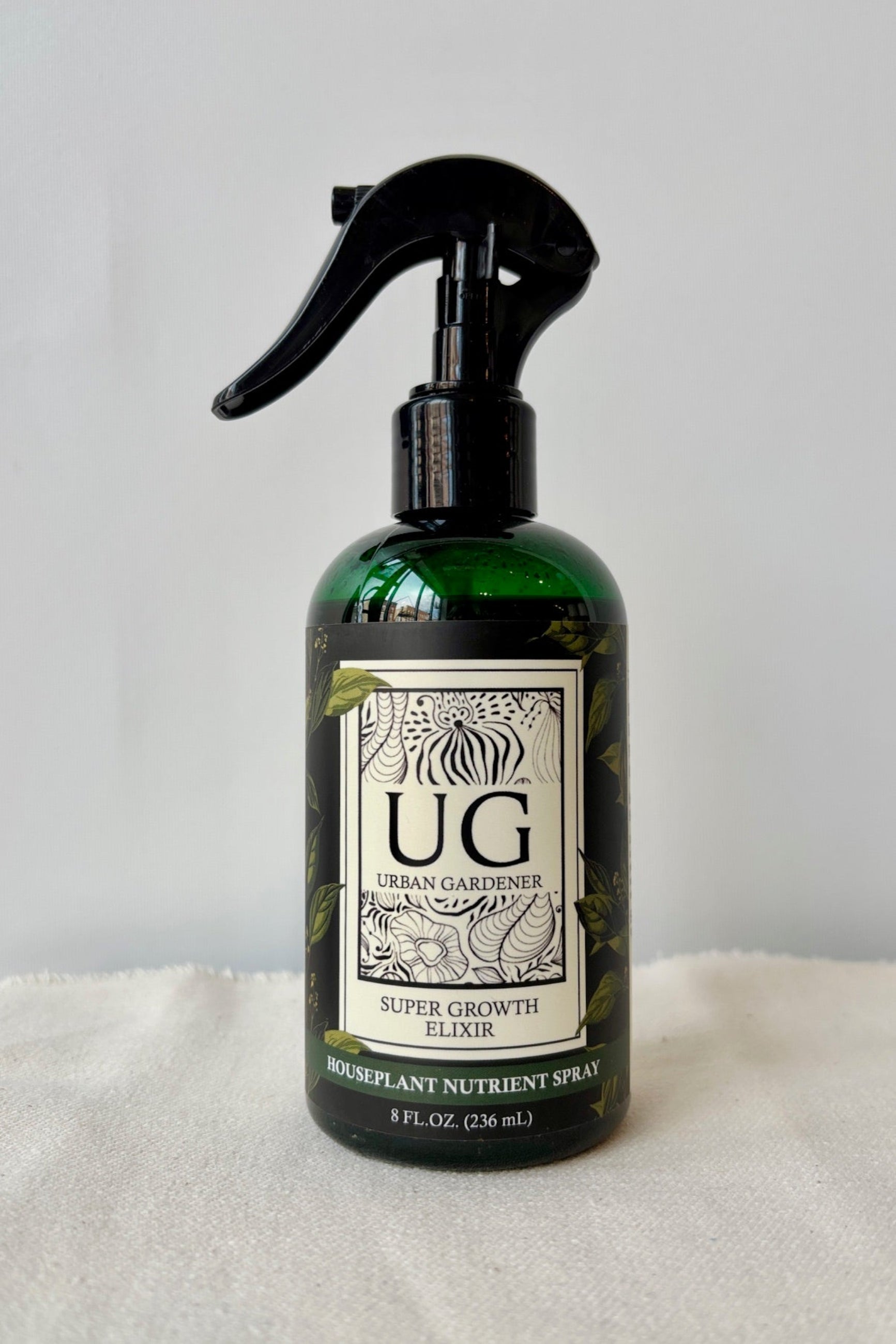 Urban Gardeners Growth Elixer in a green spray bottle against a white background ©Sprout Home