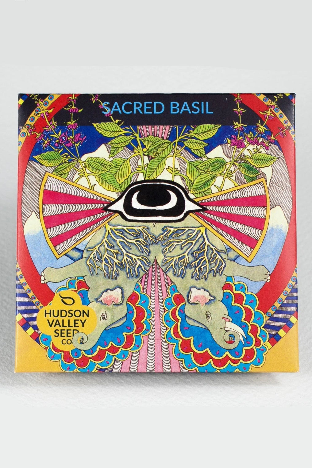 Colorful packaging for 'Sacred Basil' by Hudson Valley Seed Co with intricate designs and branding. ©Hudson Valley Seed Co.