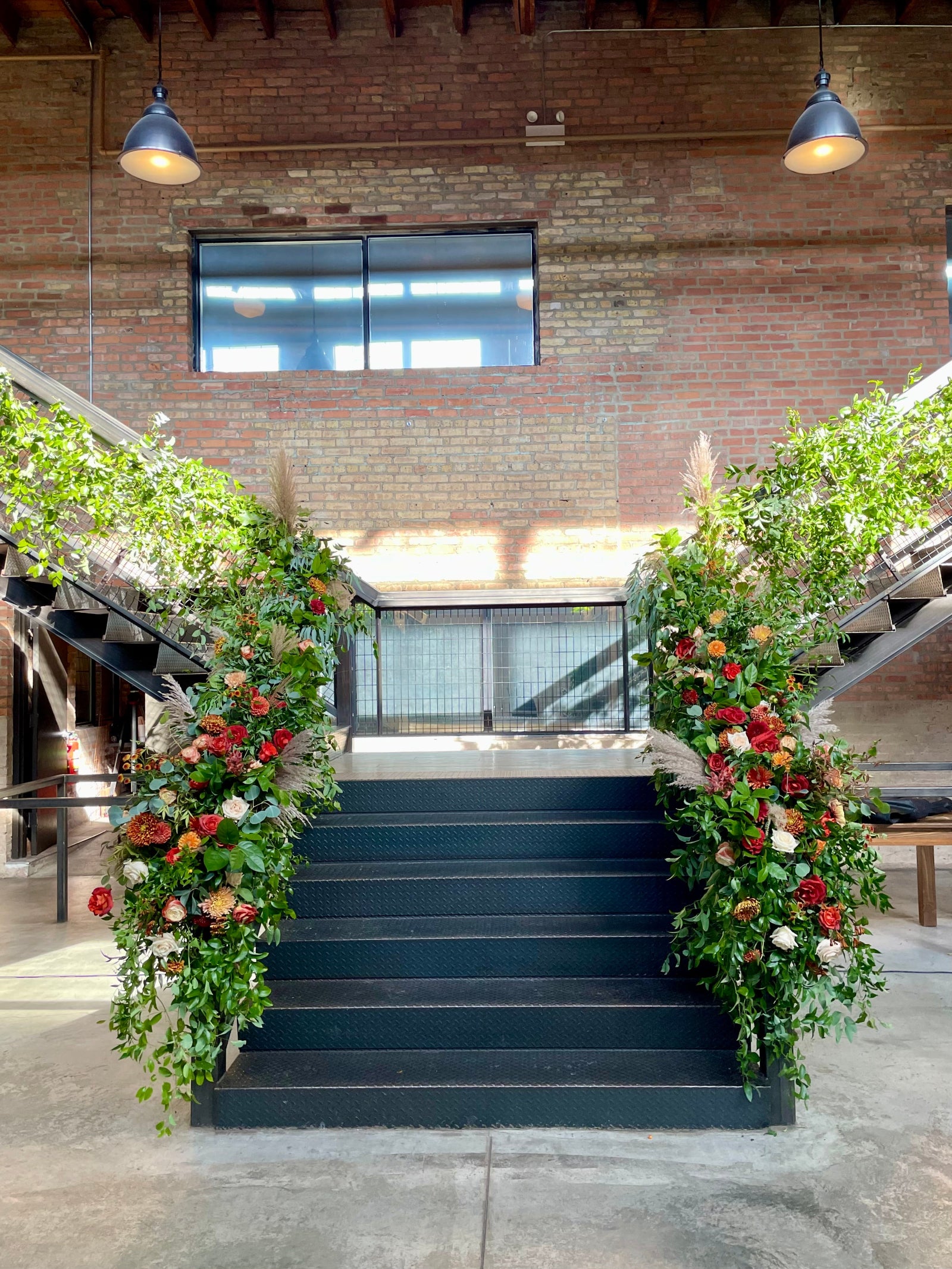 Sam & Kwaku's wedding staircase as the Ainslie in Chicago, floral by Sprout Home.