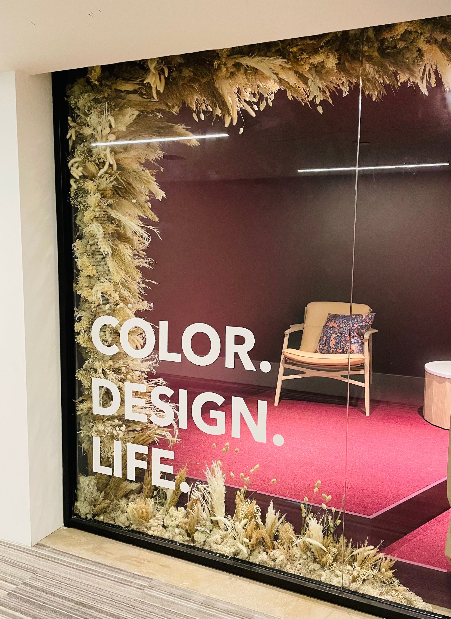 Window dried floral installation by SPROUT HOME at Scandinavian Spaces showroom in the Merchandise Mart in Chicago.