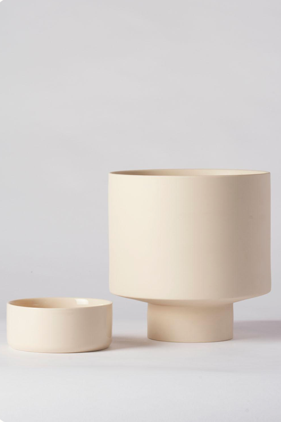 A Collectors Gro Pot by Angus & Celeste shown with the saucer set aside the pot.
