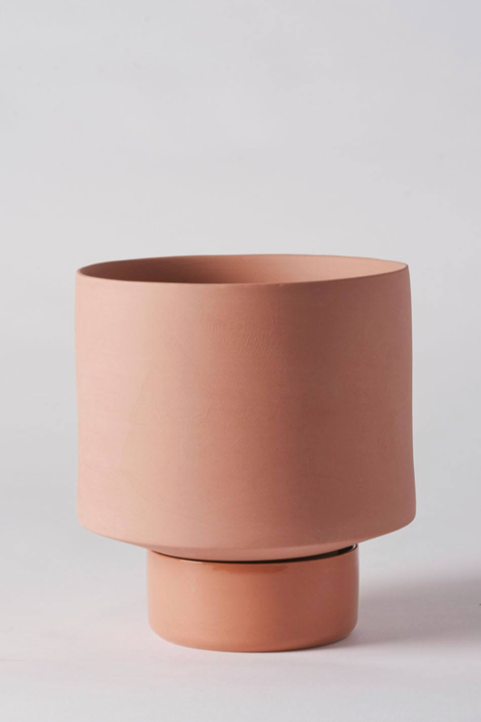 An Ochre Collectors Gro Pot from Angus & Celeste shown a white backdrop empty.