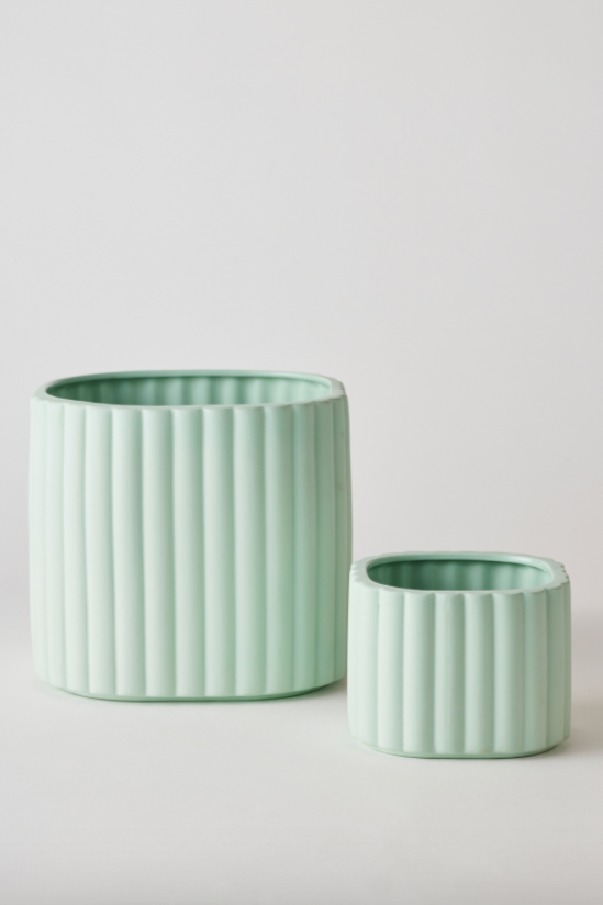 A Mint Modular Stack Planter by Angus & Celeste shown empty and the main pot and reservoir pot standing separate from one another.
