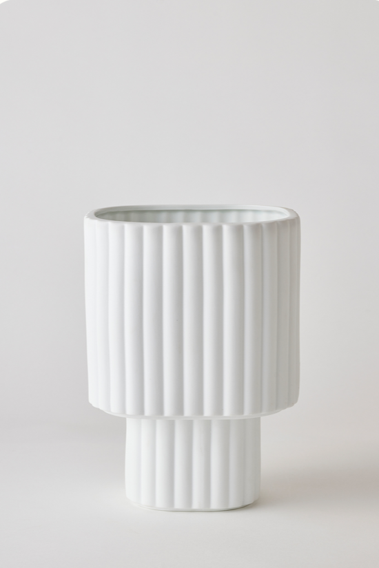 White colored Modular Stack planter by Angus & Celeste being shown empty in front of a white wall.