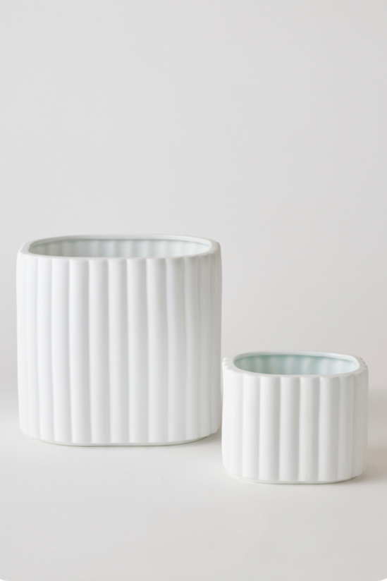 White colored Modular Stack planter by Angus & Celeste with its two parts separated and shown from the side.