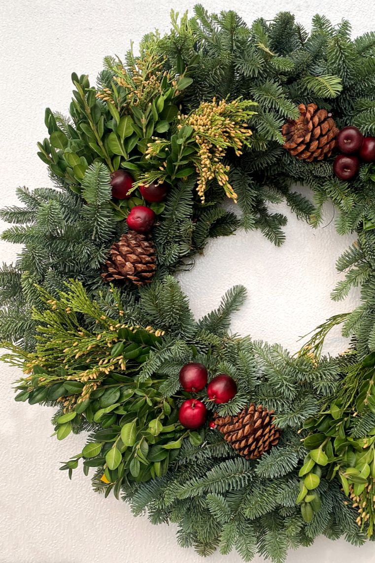 Detail of the Royal Fruit wreath against a white backdrop.