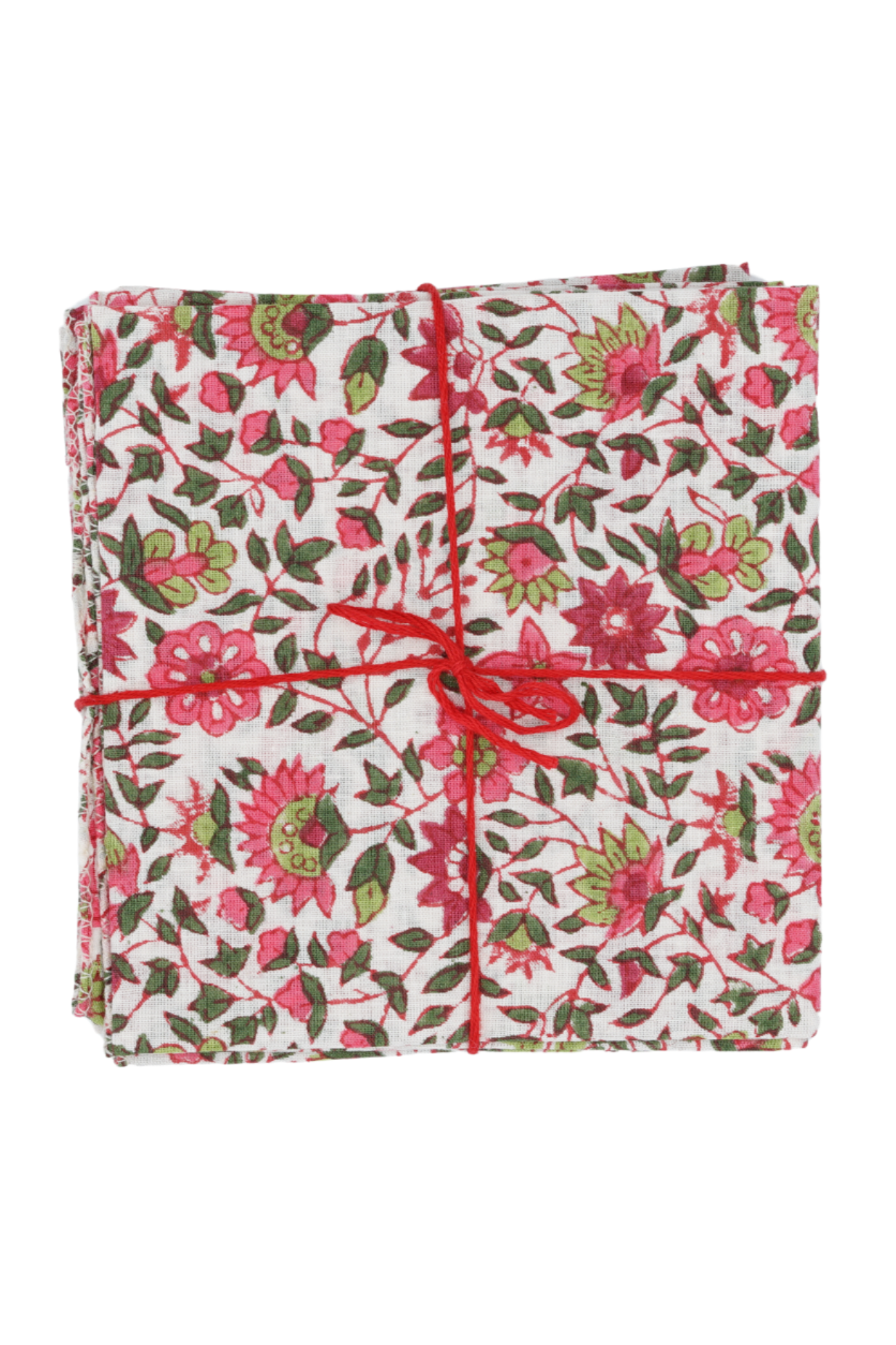 Cotton Napkins Chicorée Peonie folded in to squares, stacked and tied with a red string