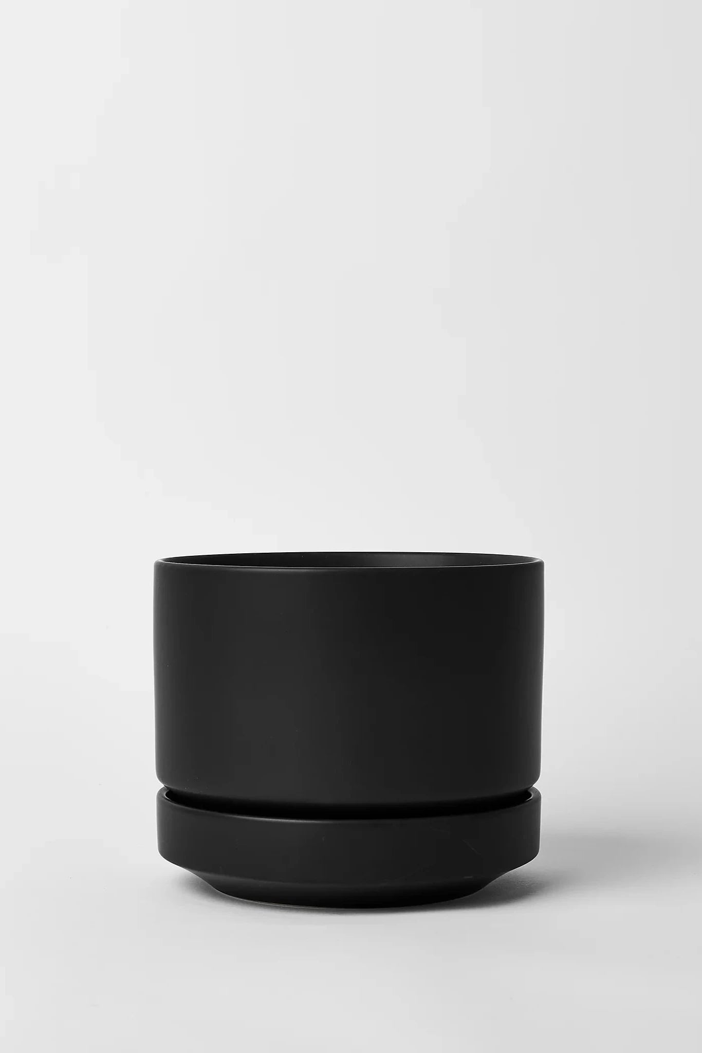 LBE Design and Revival Ceramics Black Round Two Planter in black shown from the side.