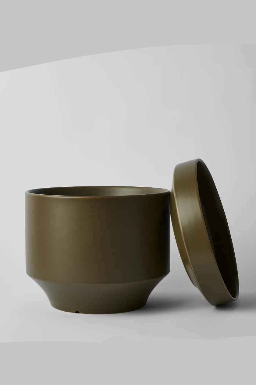 Round Two 10" Olive green ceramic pot with lid on a light gray background ©Revival Ceramics