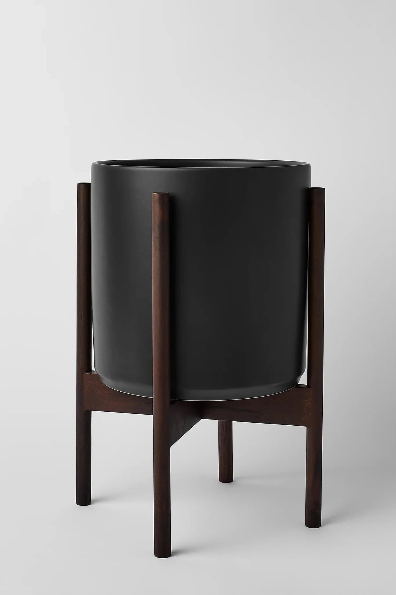 LBE Design black cylinder and dark teak stand