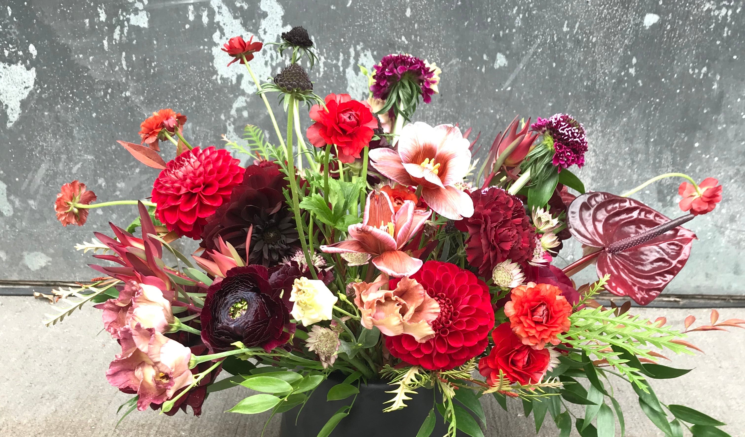 Red palette winter arrangement by Sprout Home featuring reflexed tulips ©Sprout Home