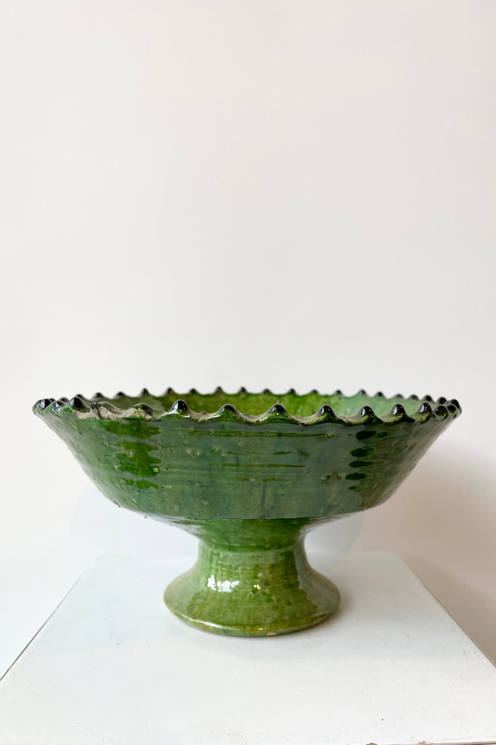 The Medium Tamegroute Green Compote at Sprout Home against a white wall. ©Sprout Home