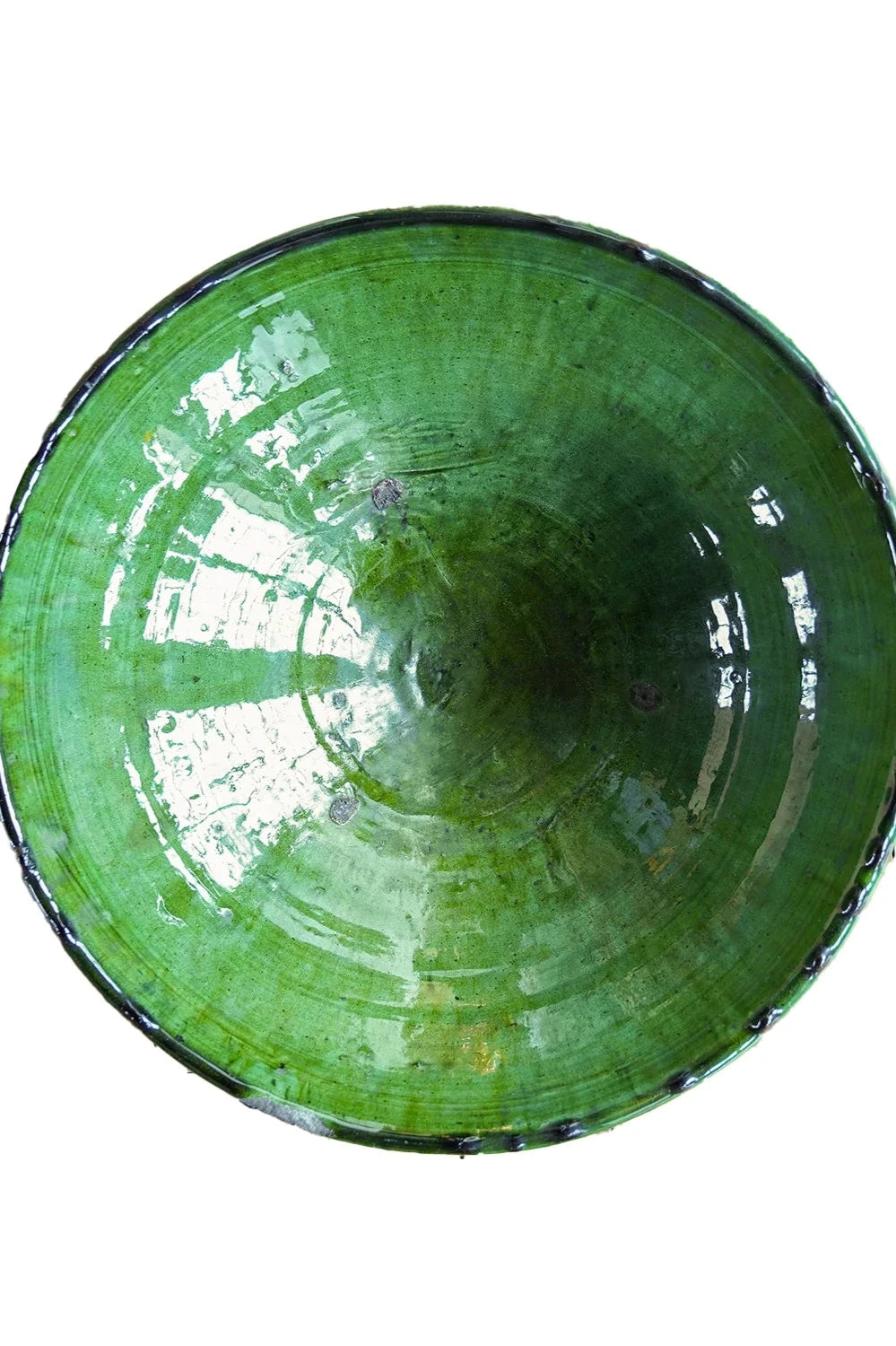 The inside of a one of a kind Tamegroute Bowl in green on a white background.©Blue Ocean Traders