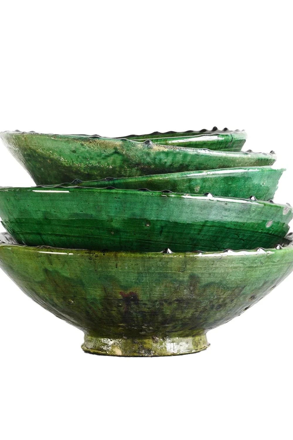 a stack of various sized green Tamegroute down stacked on one another.