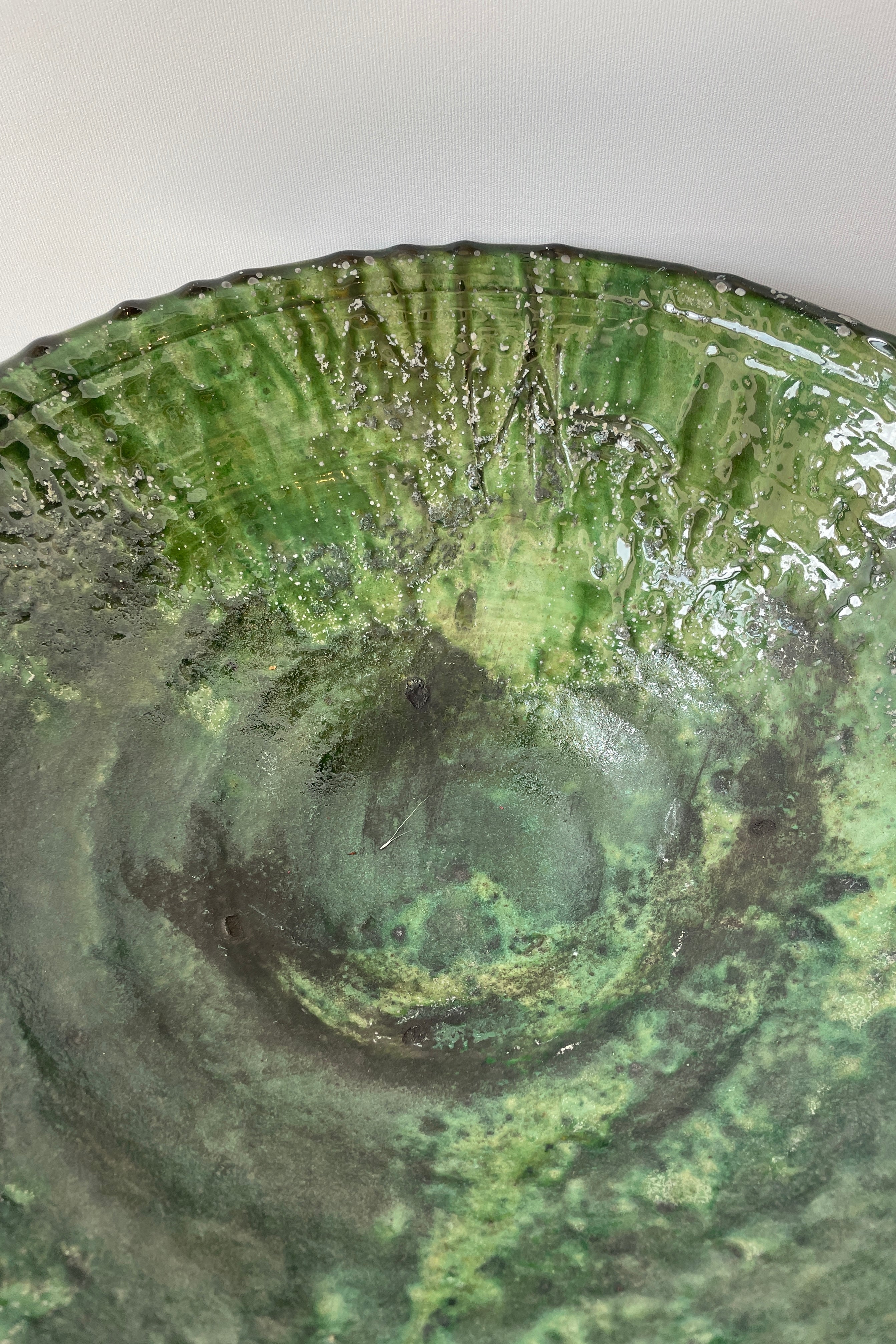 detail up close of the green finish on the Tamegroute bowl looking inside.