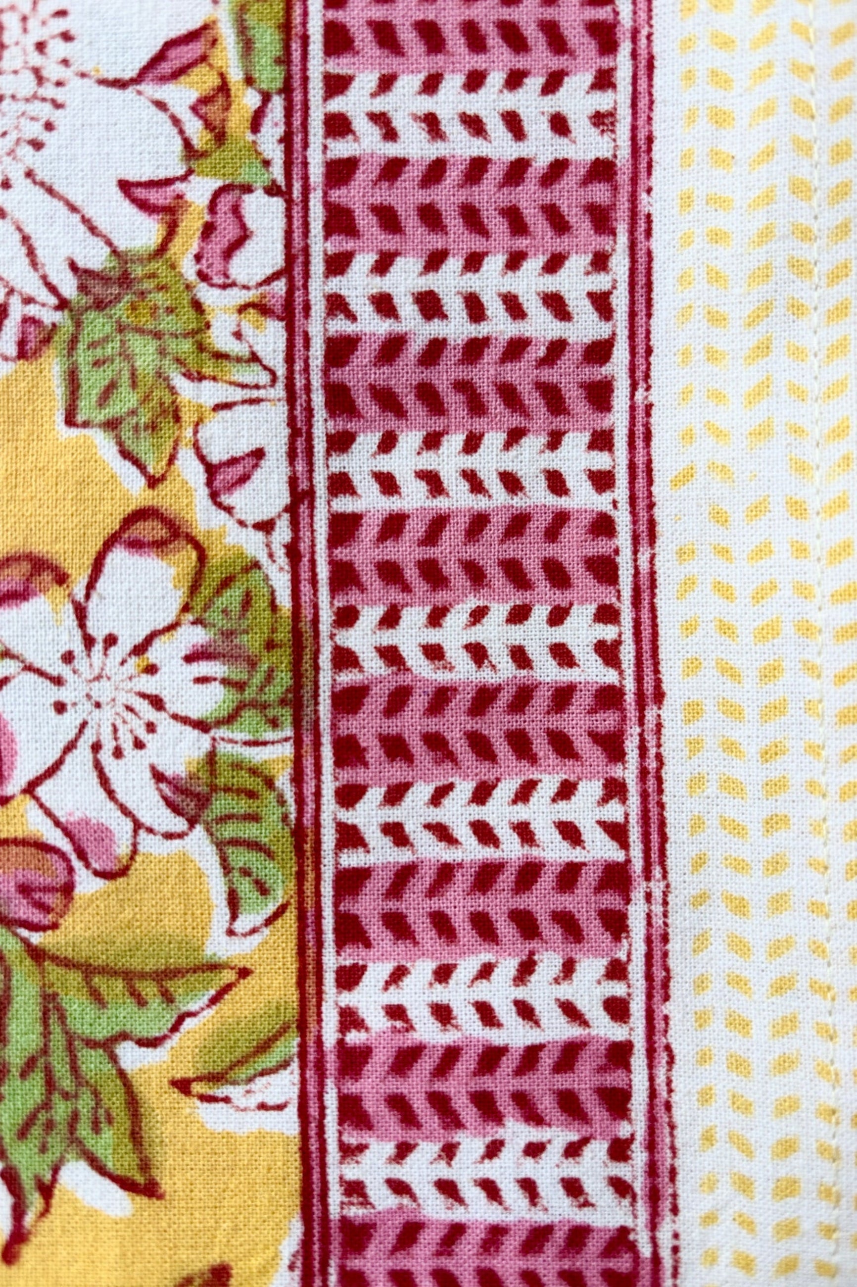Detail of trim on hand printed, 100% cotton Camelia yellow and pink tablecloth ©Sprout Home
