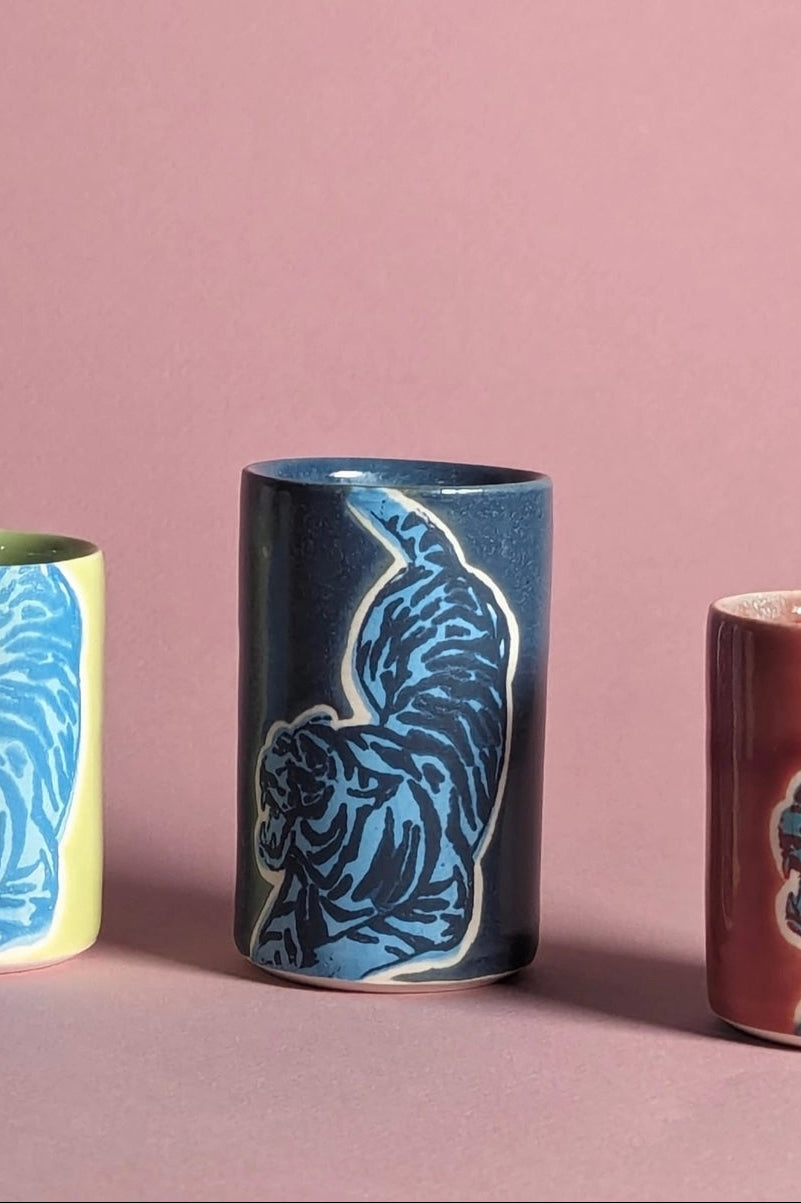 ceramic cups with animal patterns on a pink background ©City In Bloom Ceramics