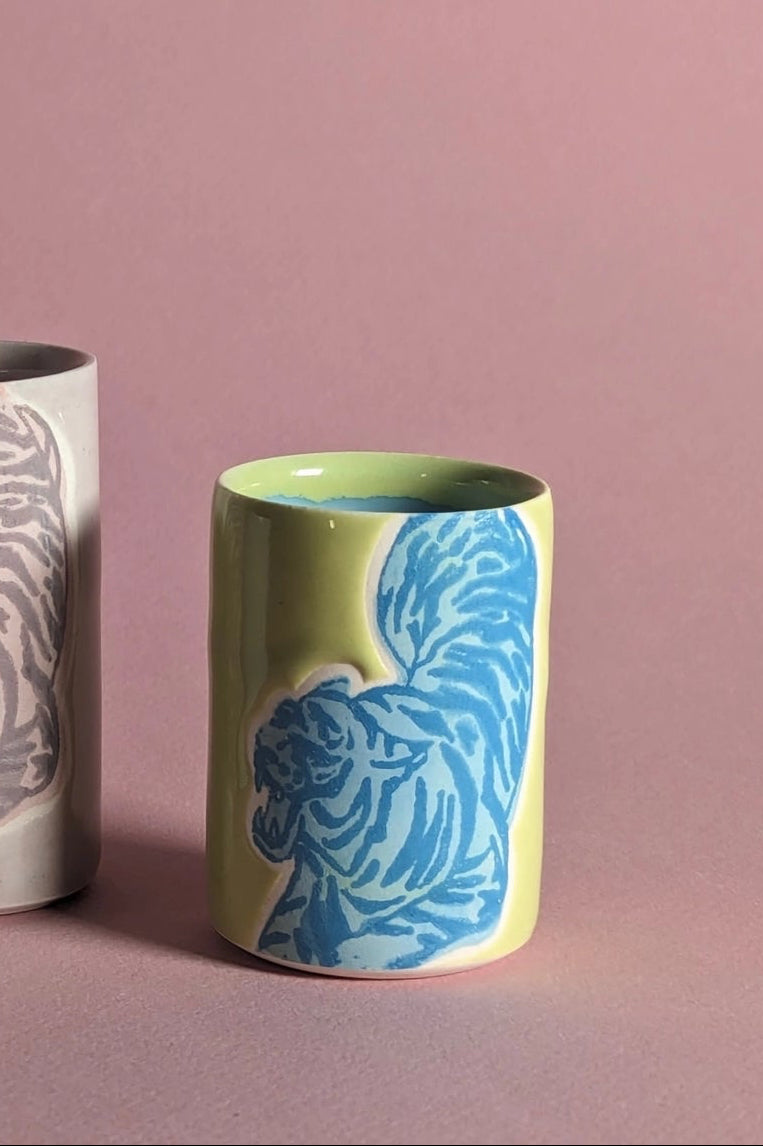 Ceramic cups with a tiger patterns on a pink background ©City in Bloom Ceramics