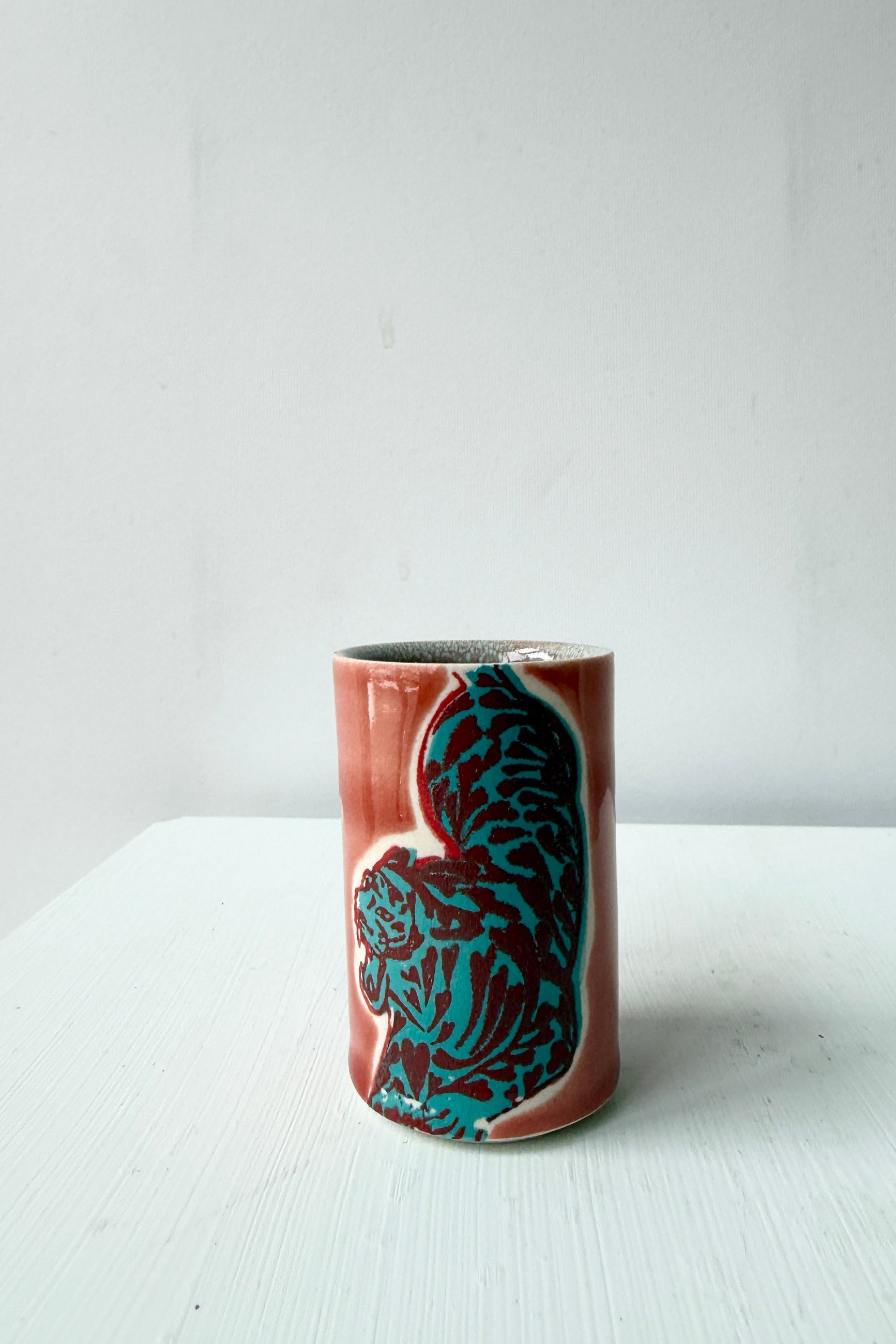 Ceramic Shot glass by City in Bloom Ceramics blue tiger design on a white surface and background ©Sprout Home