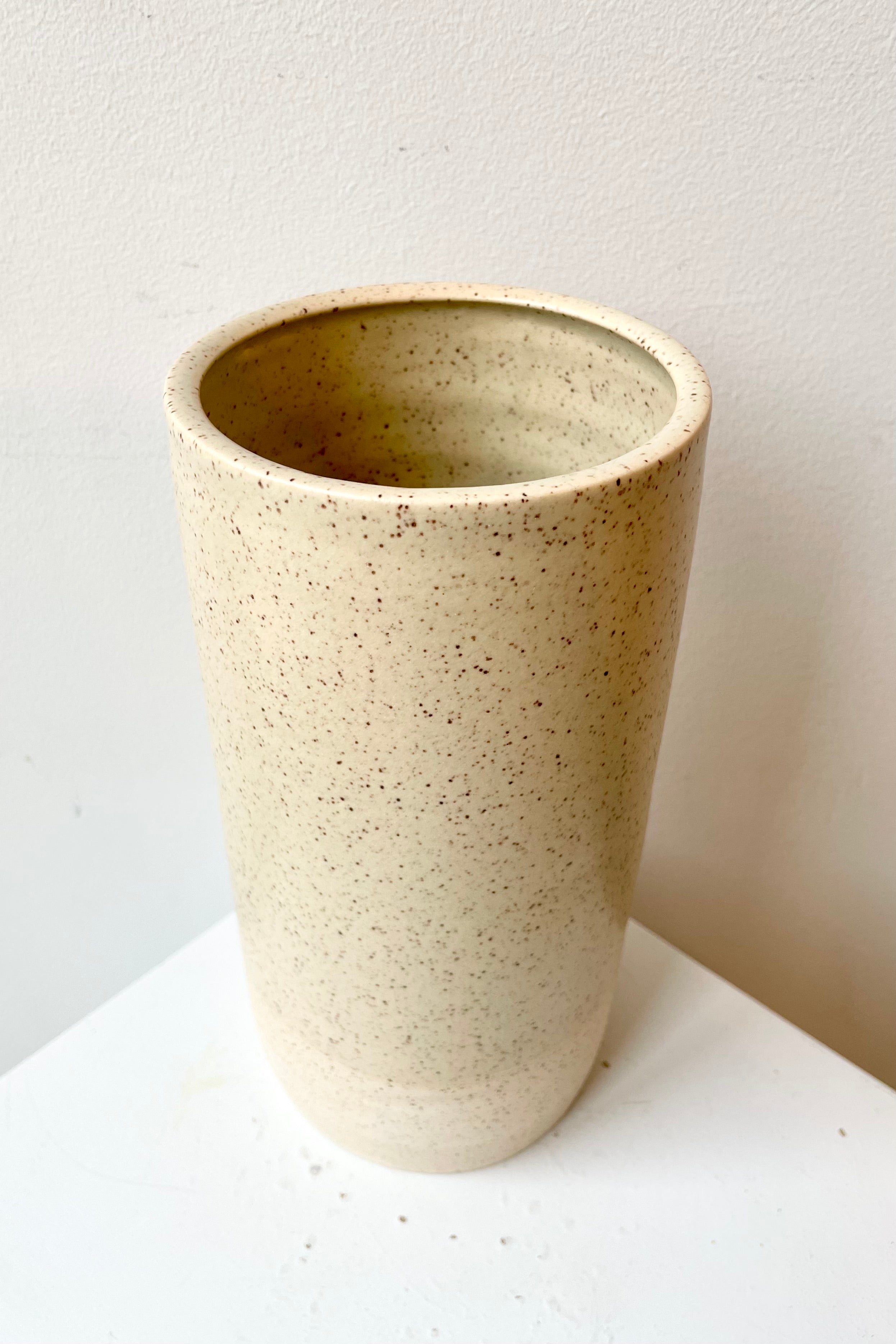 The Jacqueline Butter Speckle Large vase shown from above and side to view inside.