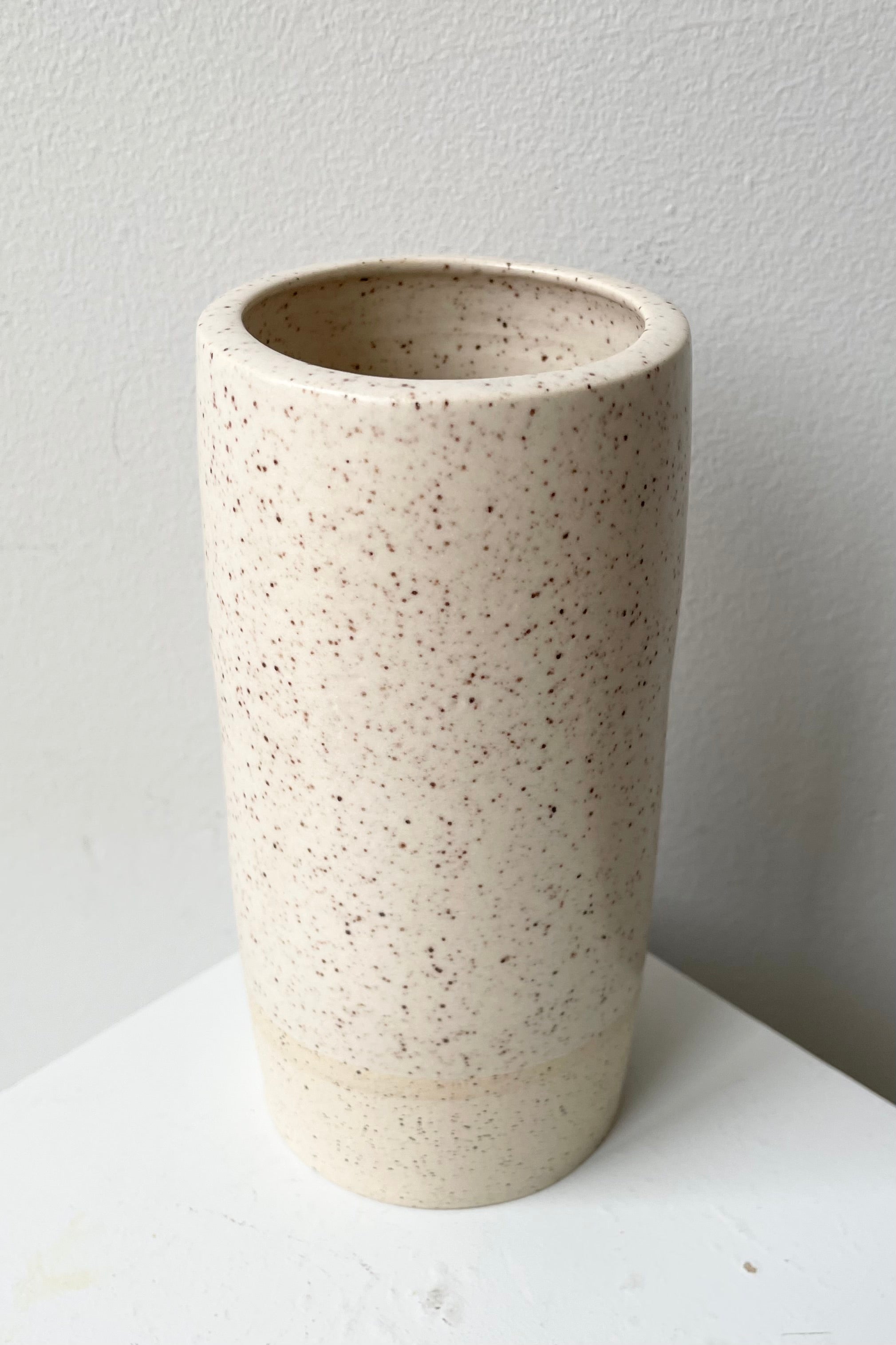 Jacqueline Vase in Cream Speckle small shown from above a side.